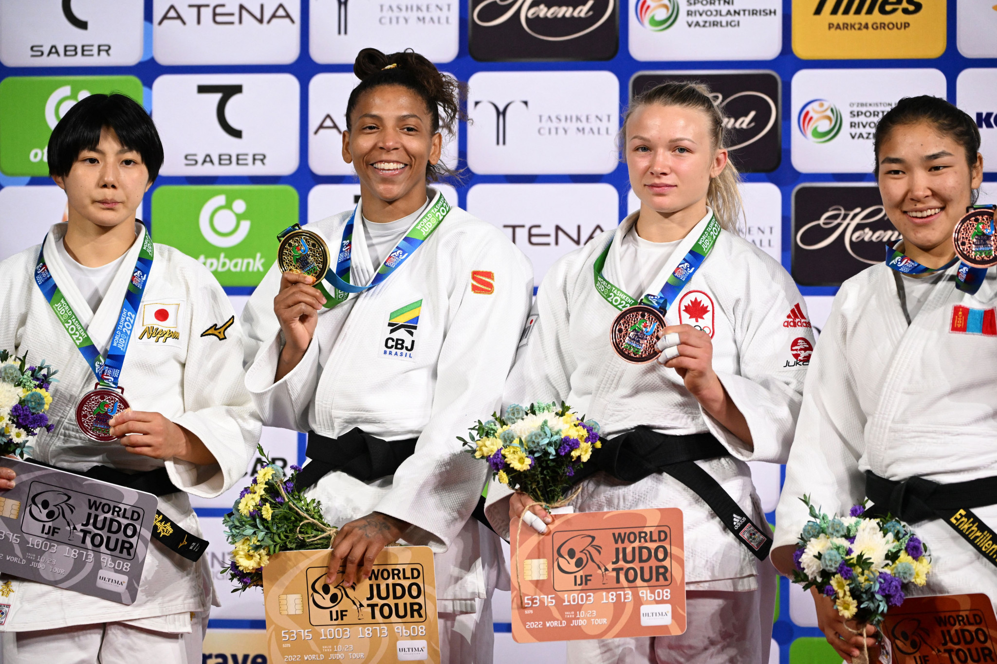 2021 champion Jessica Klimkait of Canada, third right, and Mongolia's Enkhriilen Lkhagvatogoo, right, made up the podium in the women's tournament ©Getty Images