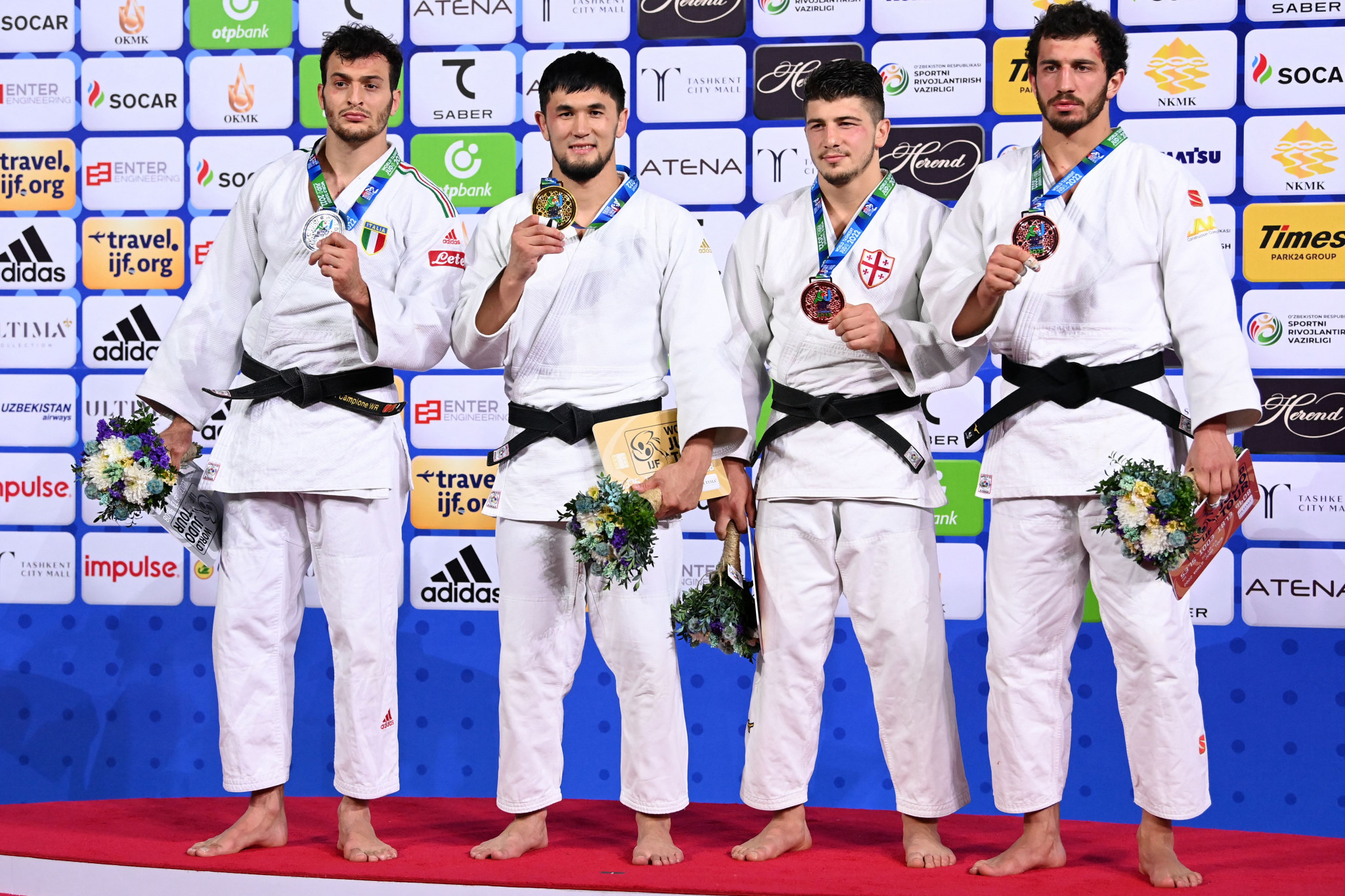 Georgian duo Luka Maisuradze, third right, and Lasha Bekauri, right, made up the men's podium as they claimed the bronze medals ©Getty Images