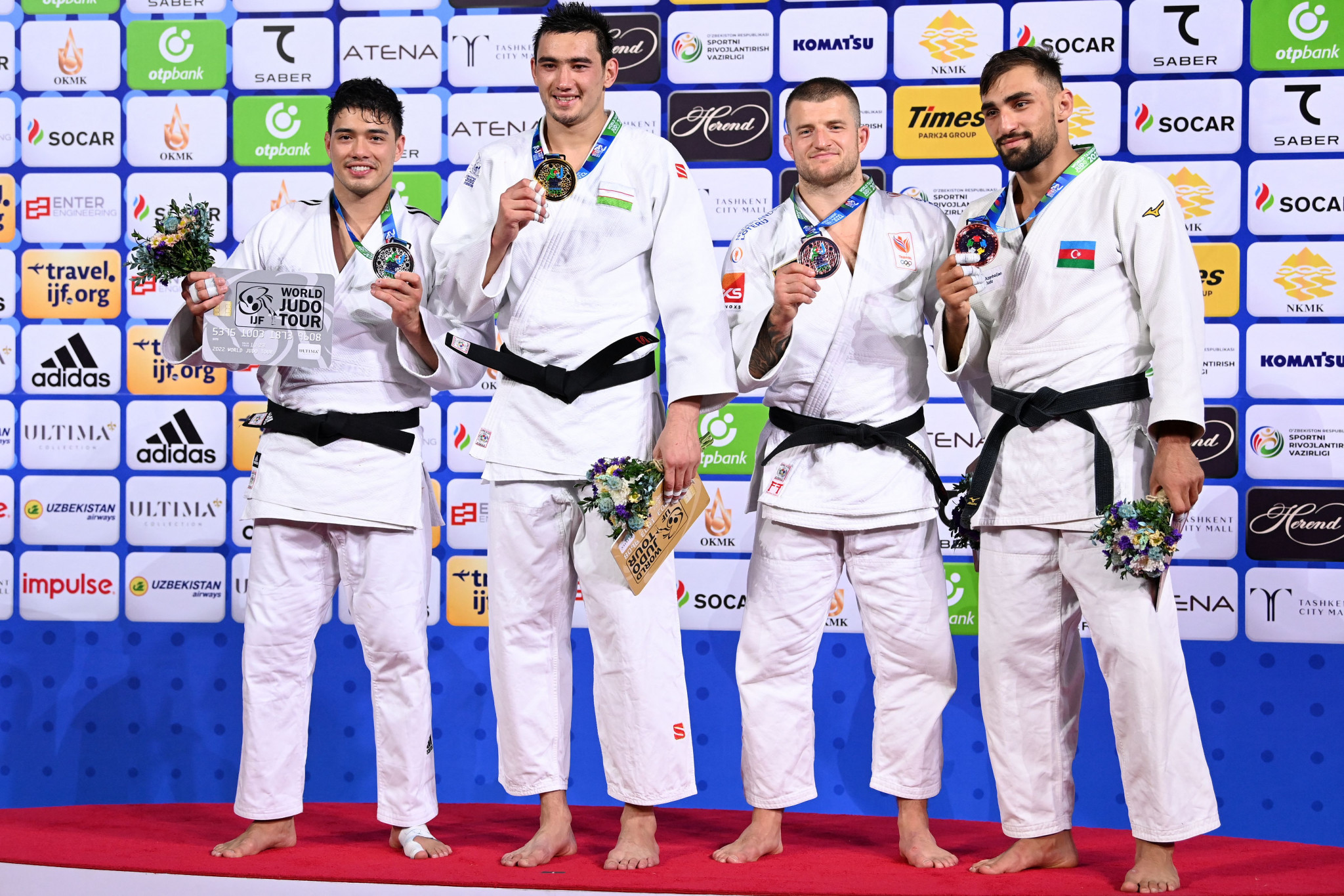 The Netherlands' Michael Korrel, second right and Azerbaijan's Zelym Kotsoiev, right, clinched the bronze medals in the men's under-100kg tournament ©Getty Images