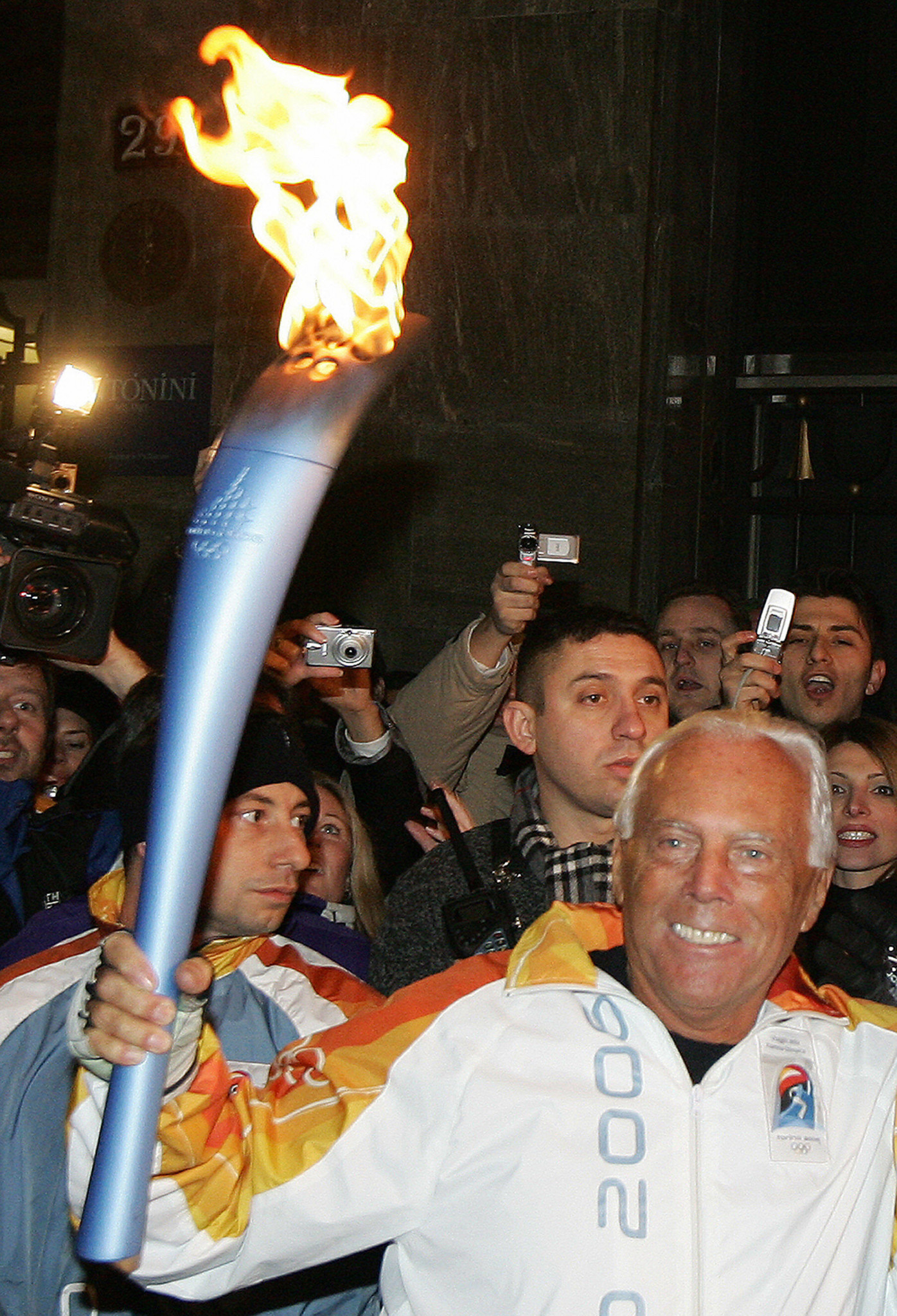 Giorgio Armani carried the Olympic Flame in 2006, the last time Italy held the Winter Olympics ©Getty Images