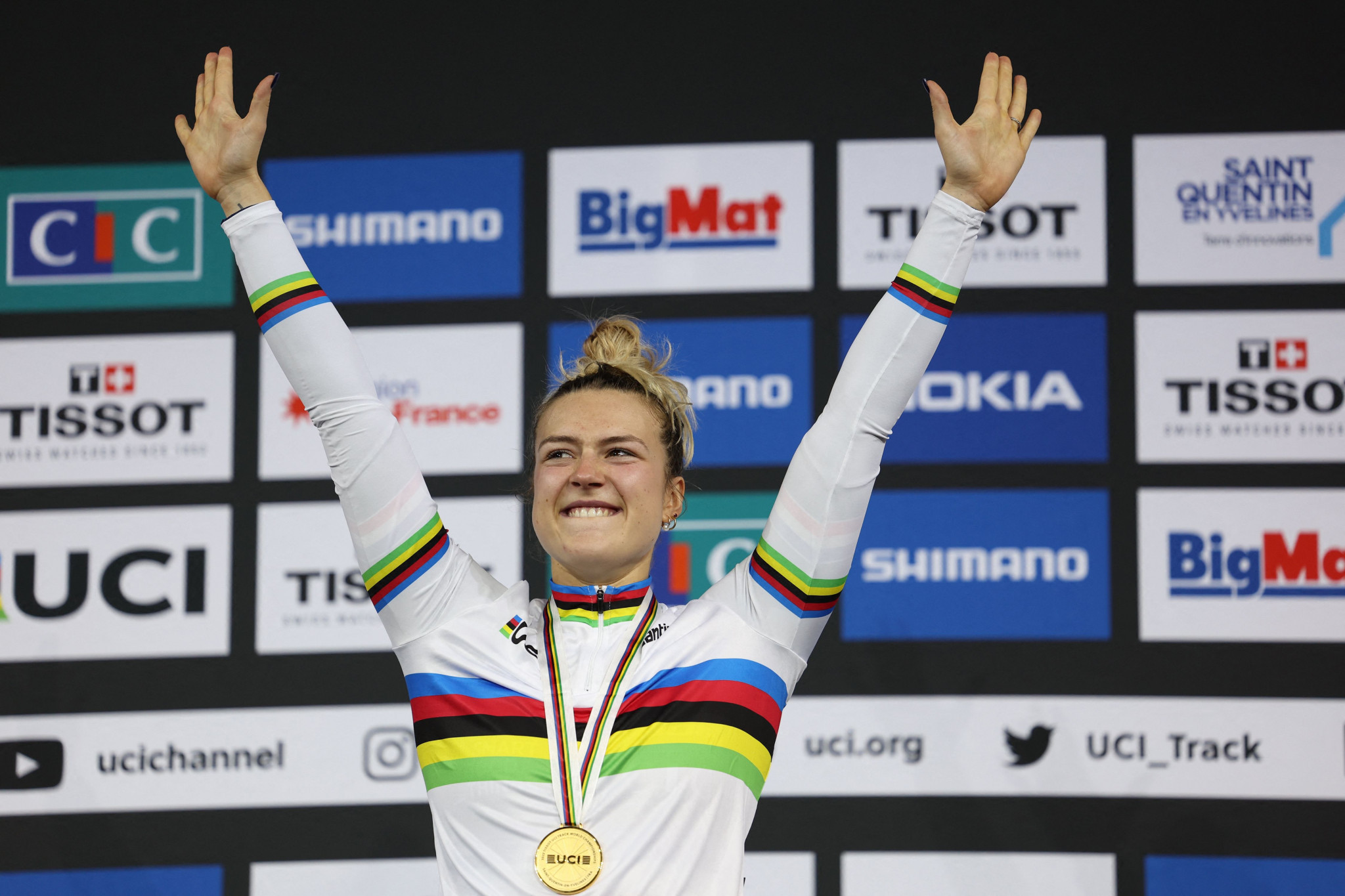Mathilde Gros raises her arms in celebration after winning the women's sprint title ©Getty Images