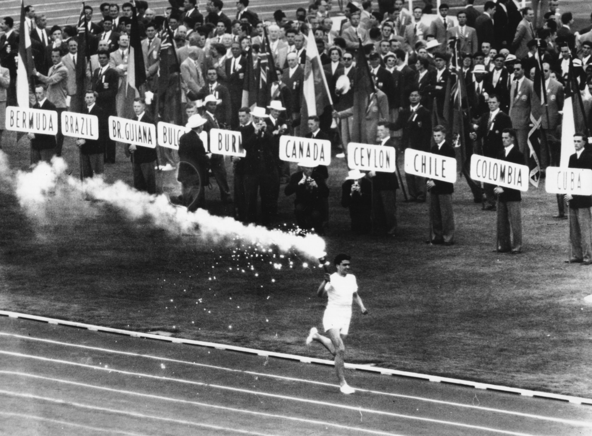 Ron Clarke carried the Olympic Flame into the Melbourne Cricket Ground for the 1956 Opening Ceremony held in late November ©Getty Images