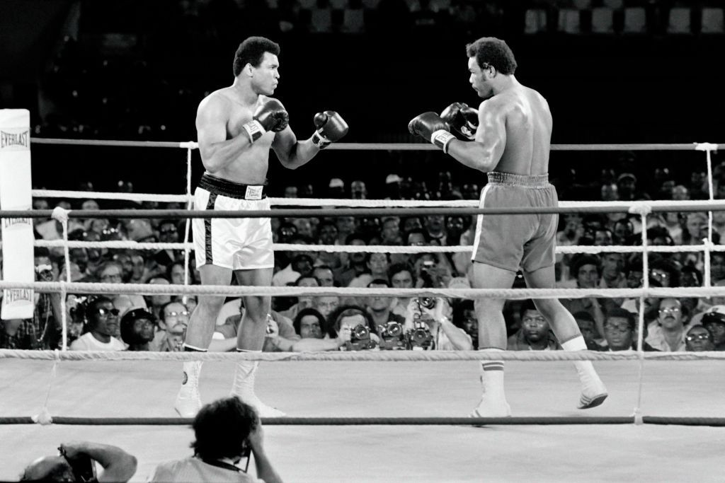 Muhammad Ali, left, regained his world boxing heavyweight title with victory over George Foreman in the 1974 fight staged by Zaire and known as The Rumble in the Jungle ©Getty Images