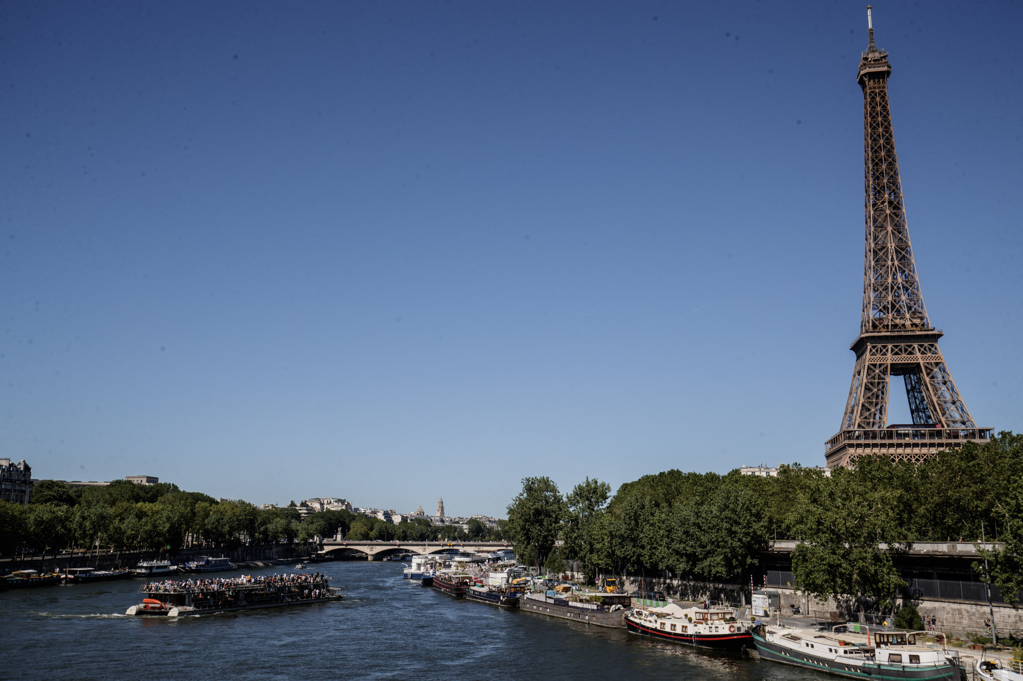 Paris 2024 organisers are pushing forward with having delegates travel by boat on the River Seine with 600,000 onlookers ©Getty Images