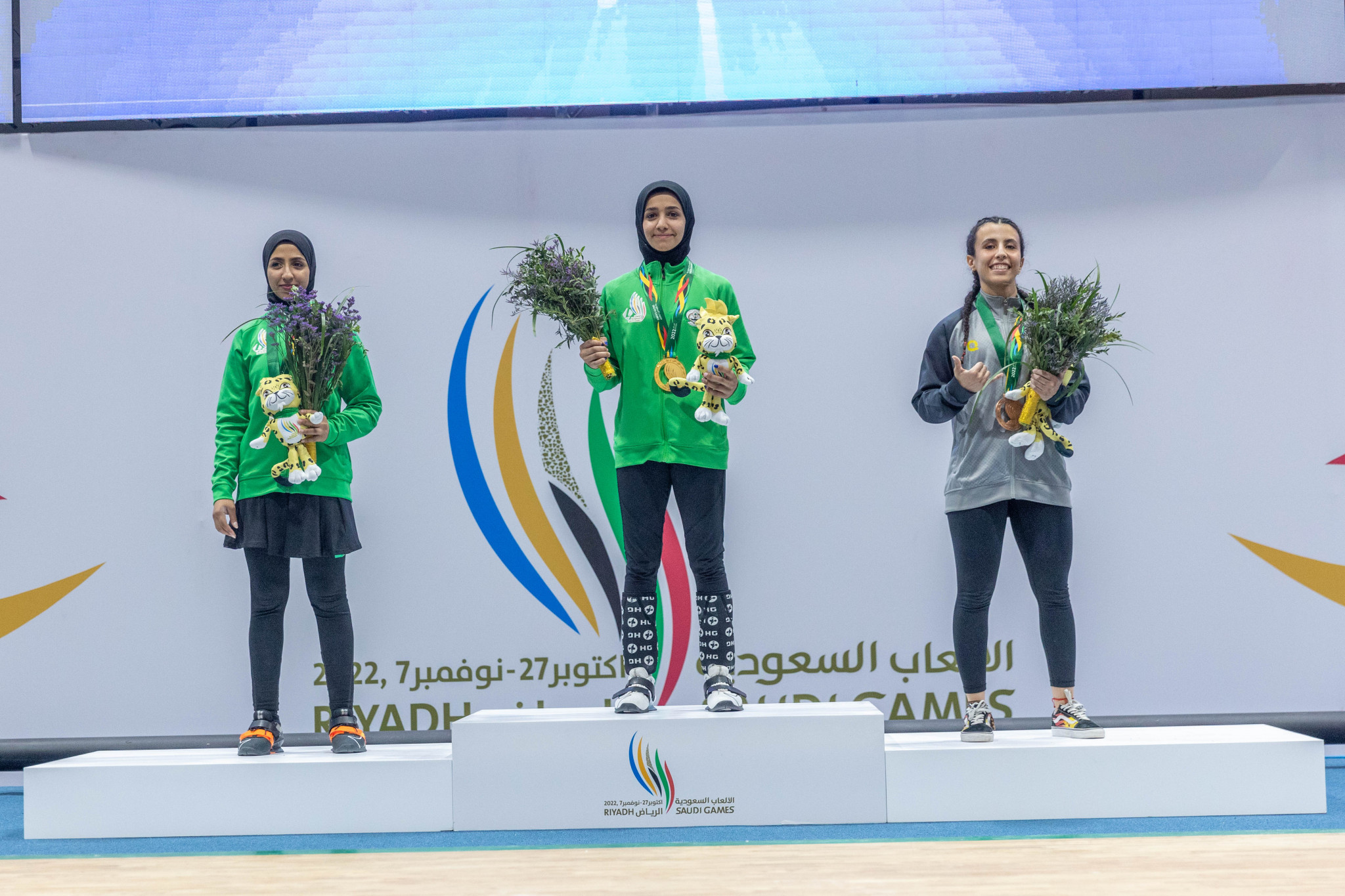 Rahmah Alkhawahr, centre, became a history-maker after winning the first Saudi Games gold medal ©Saudi Games