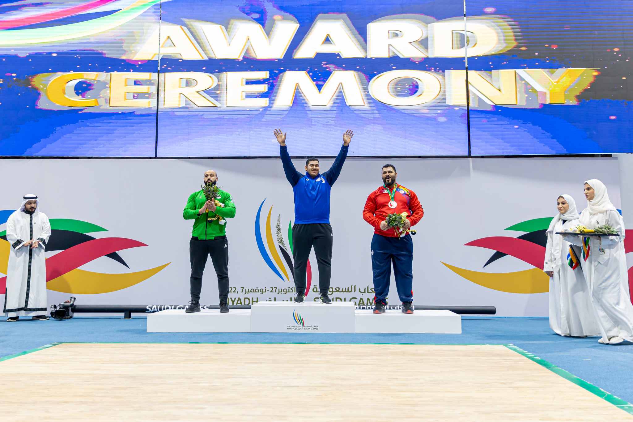 Hassan Al-Radhi, centre, performed a remarkable weightlifting comeback to win gold ©Saudi Games