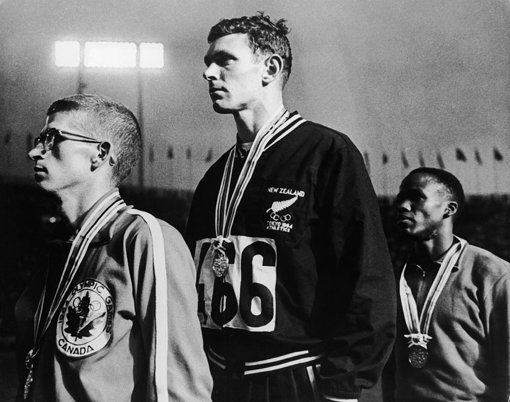 Wilson Kiprugut, right, Kenya's first Olympic medallist, pictured after taking bronze in the 800m at the 1964 Games, has died aged 84 ©Getty Images
