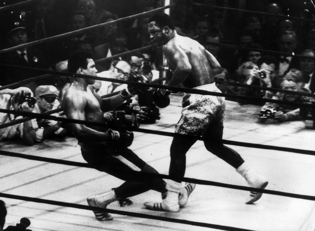 Muhammad Ali goes down in the 15th round to a left hook from world heavyweight champion Joe Frazier 