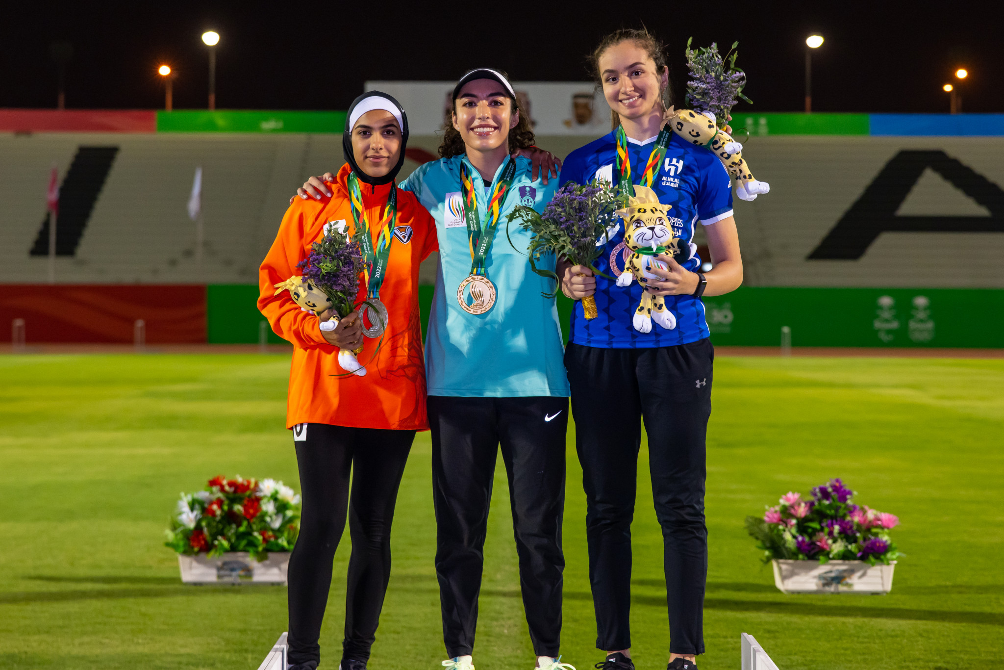 Yassmien Al-Dabbagh, centre, won gold in the women's 100m as Lujain Al-Humaid, left, and Yara Abo Al-Jadaiel took silver and bronze ©Saudi Games