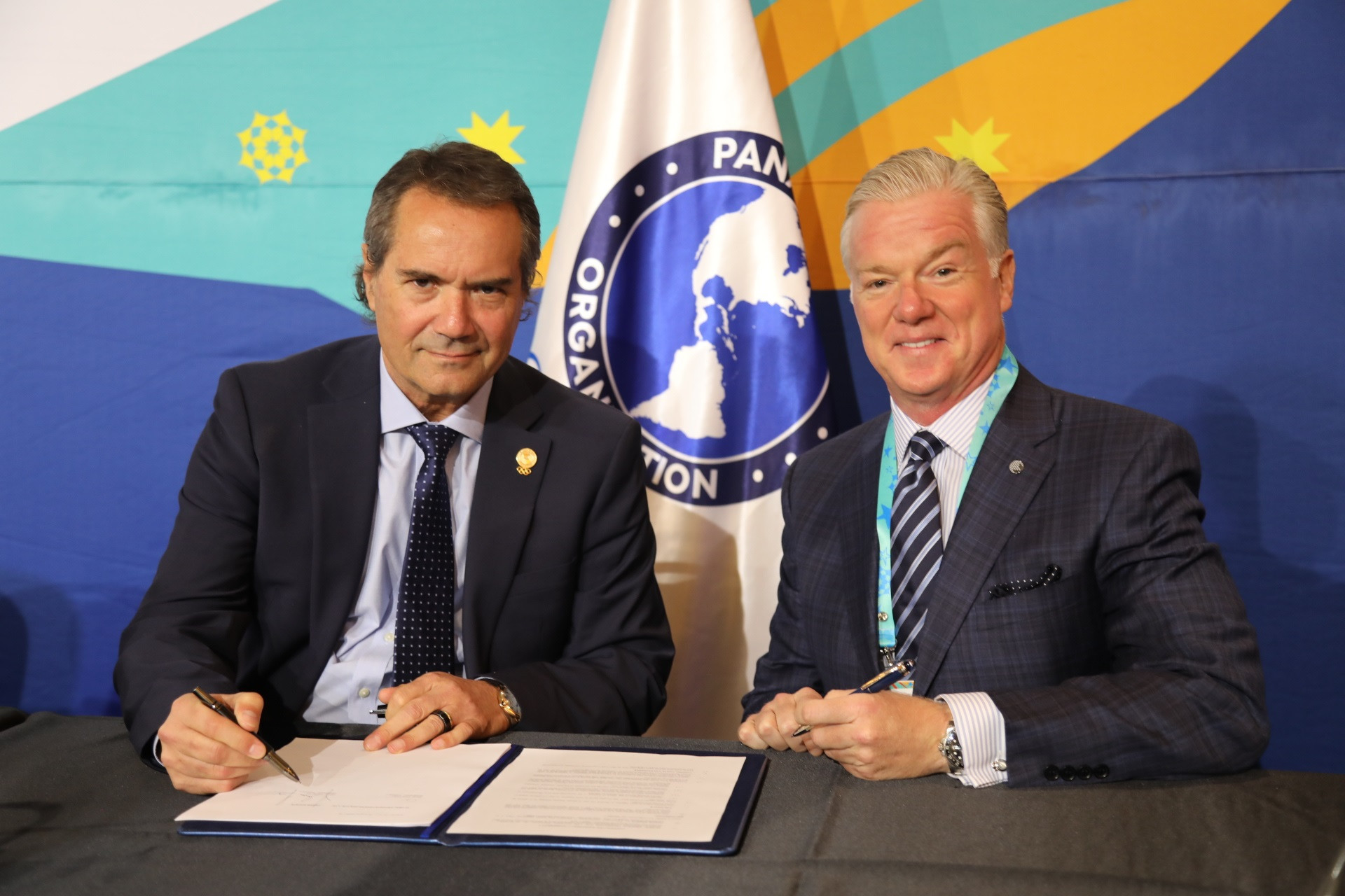 Panam Sports President Neven Ilic, left, and GEF chief executive Paul Foster, right, have agreed to stage the Pan American Esports Championships alongside the Pan American Games next year ©Panam Sports