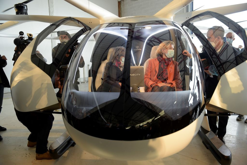 President of Île-de-France Valerie Pecresse, right, getting the lowdown on the proposed automatic flying taxi from Volocopter chief executive Florian Reuter during test flights last summer ©Getty Images