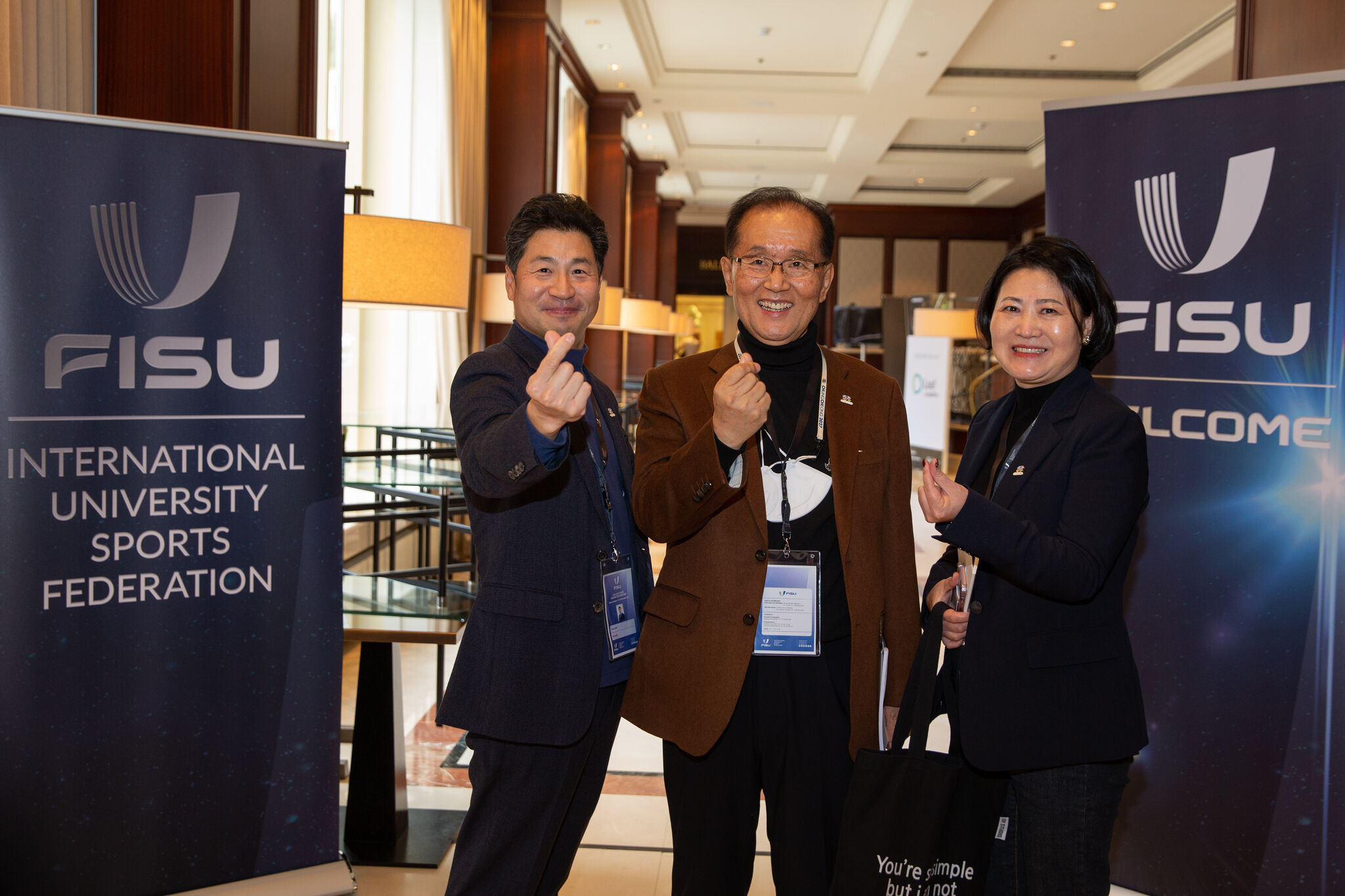 Chungcheong 2027 secretary general Kim Yoon-suk, centre, said he was "thrilled" about the decision ©FISU