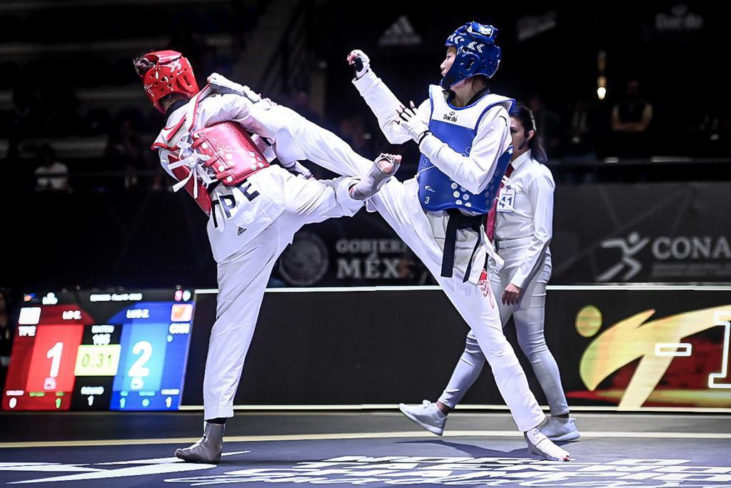 Lo Chia-ling of Chinese Taipei is on the receiving end of a kick from Luo ©World Taekwondo
