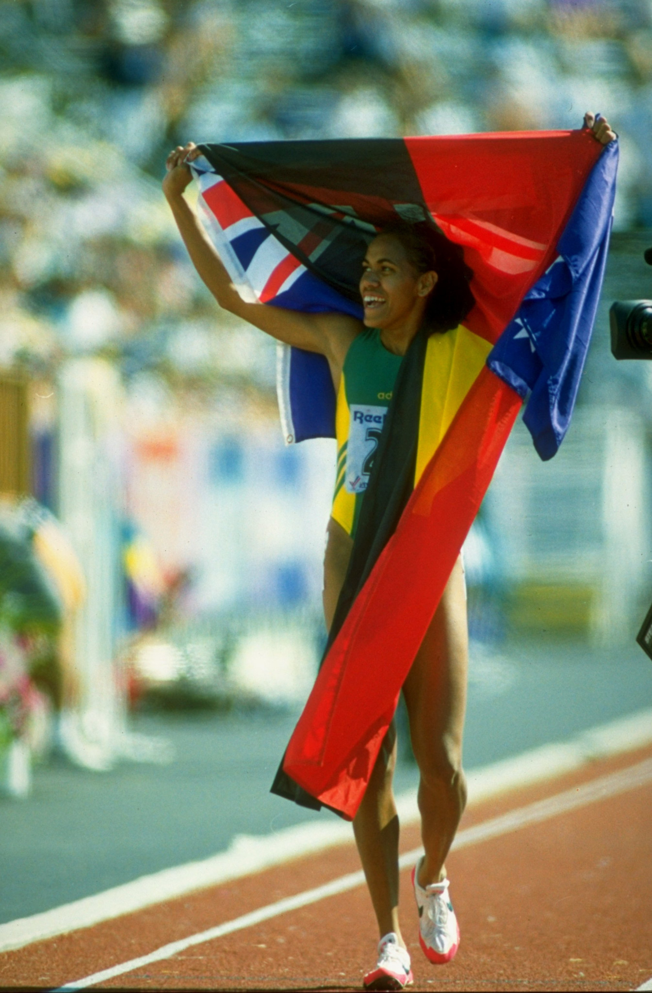 Cathy Freeman displayed the Aboriginal flag after her victories at the 1994 Commonwealth Games in the 200m and 400m but was rebuked by team official Arthur Tunstall for so doing ©Getty Images