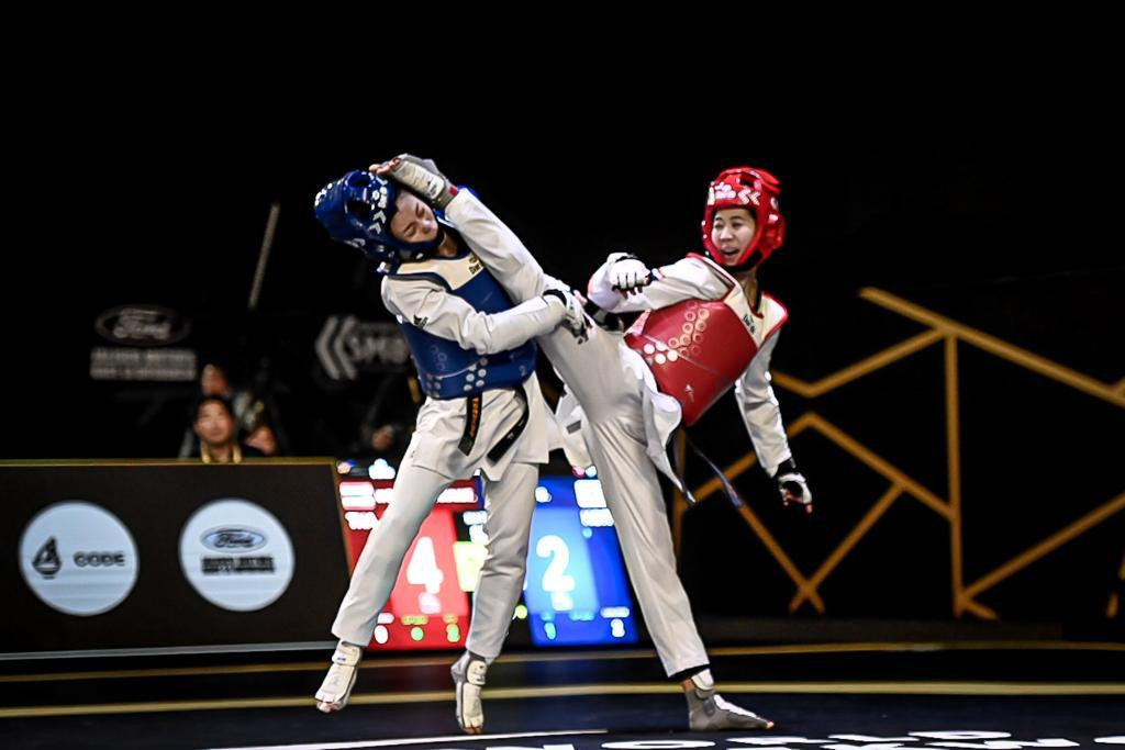 Olympic champion Panipak Wongpattanakit 
connects with a kick to the head but lost her semi-final ©World Taekwondo