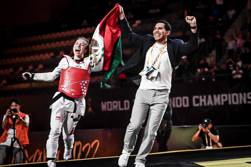 Souza celebrates with her coach as Mexico earned their second gold of the tournament ©World Taekwondo
