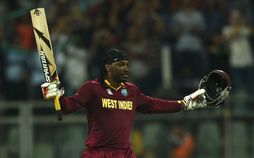 Chris Gayle celebrates reaching three figures against England today ©Getty Images