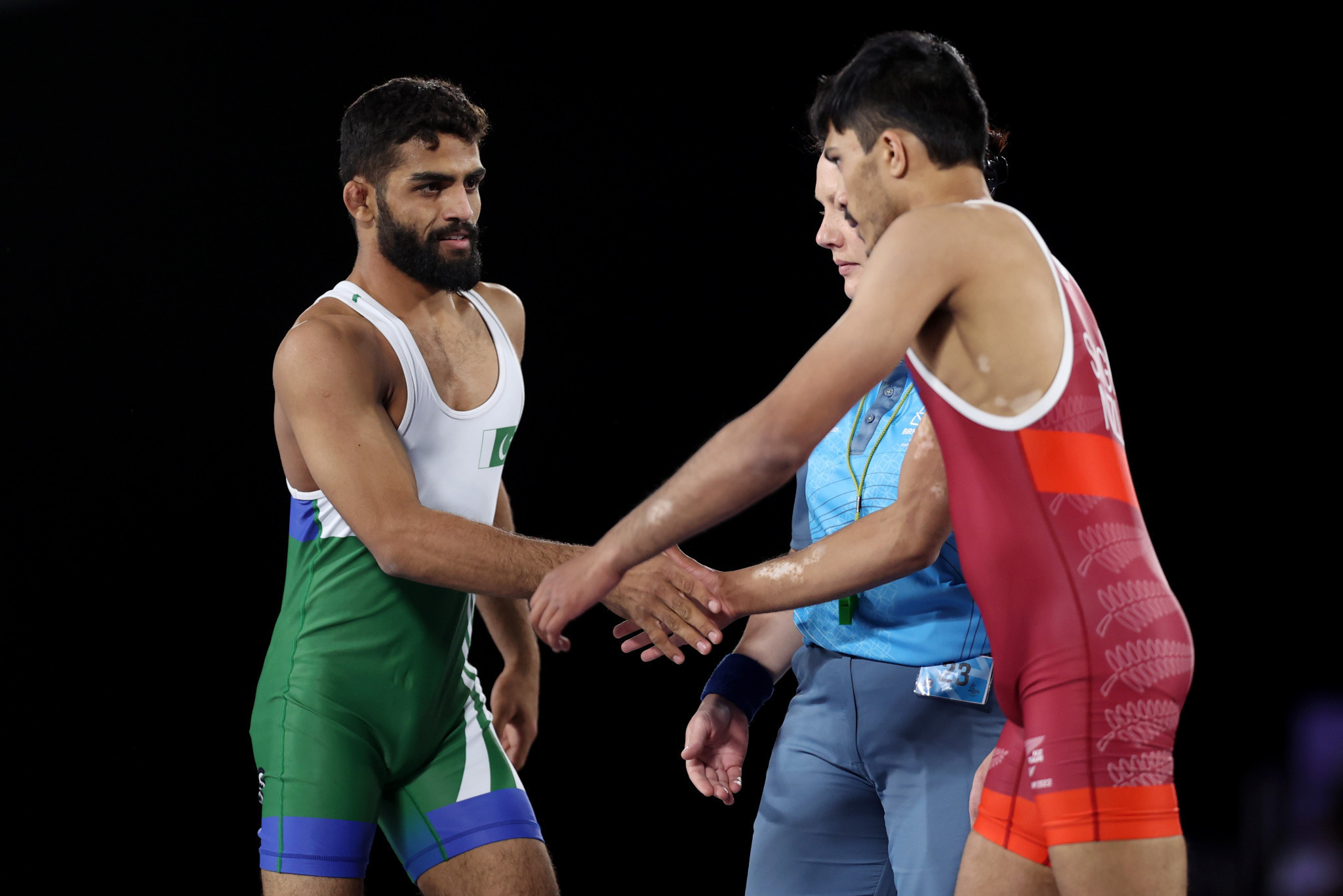 Ali Asad, left, defeat Suraj Singh, right, in the men's under-57kg wrestling repechage round at Birmingham 2022 but has since been disqualified ©Getty Images