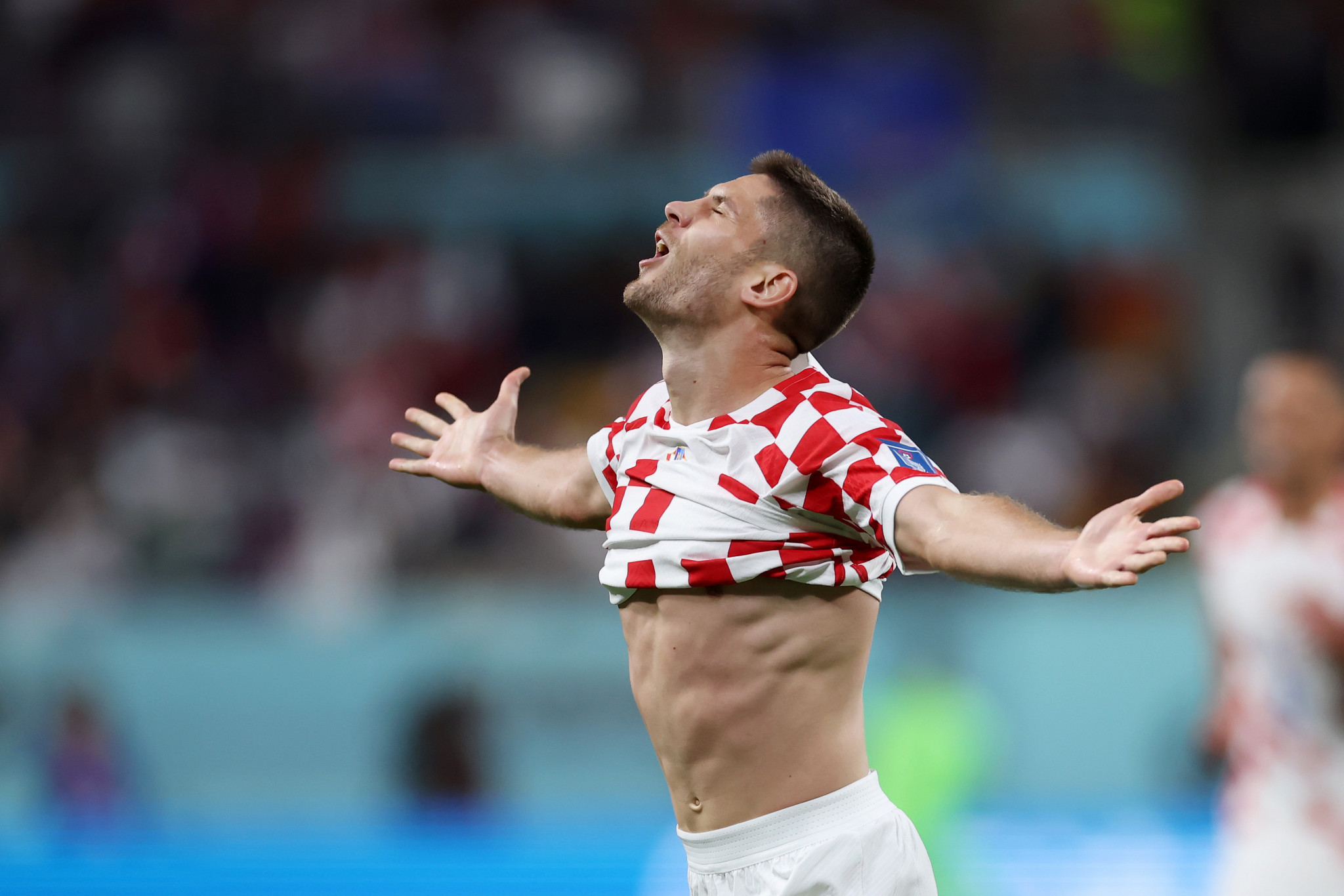 Andrej Kramaric lifts his shirt in celebration after netting twice for Croatia against Canada ©Getty Images