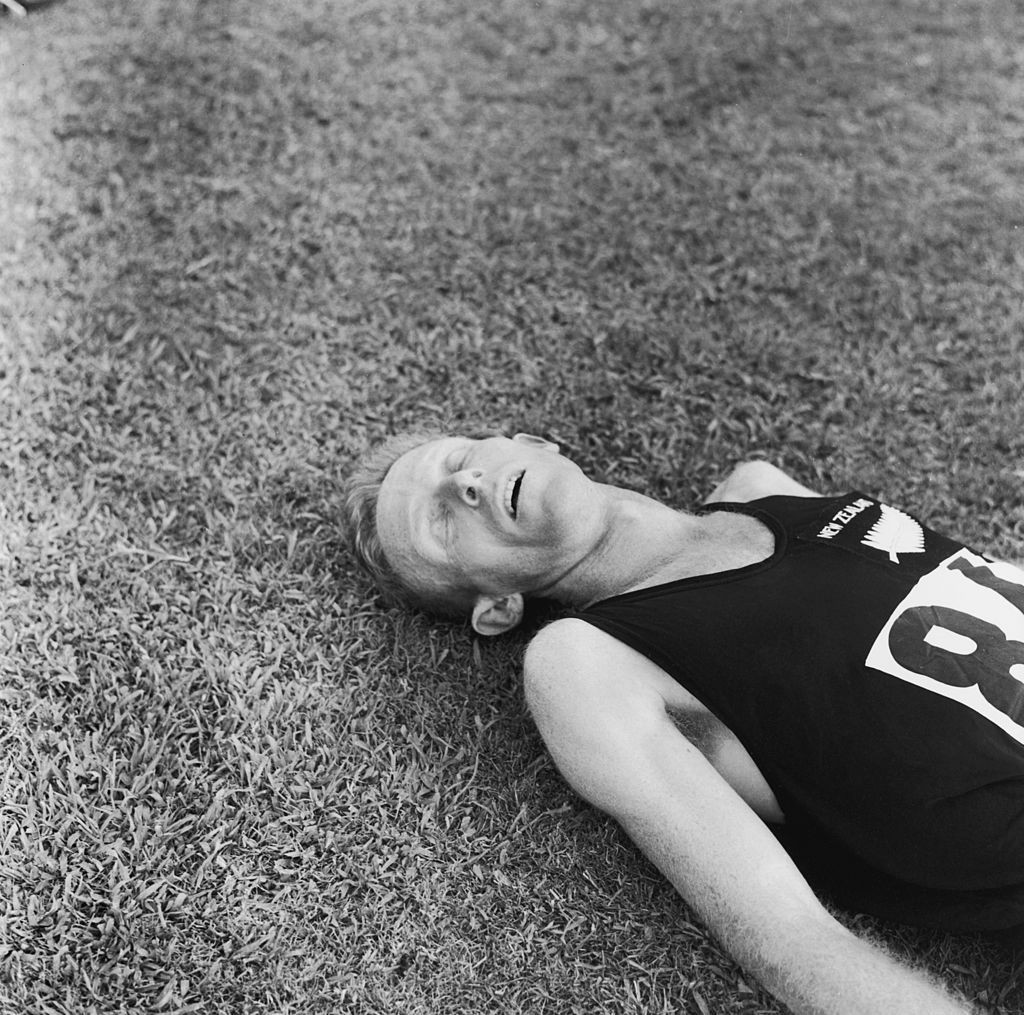 Murray Halberg lies exhausted after winning the 1960 Olympic 5,000m title in Rome with three pulverising final laps ©Getty Images