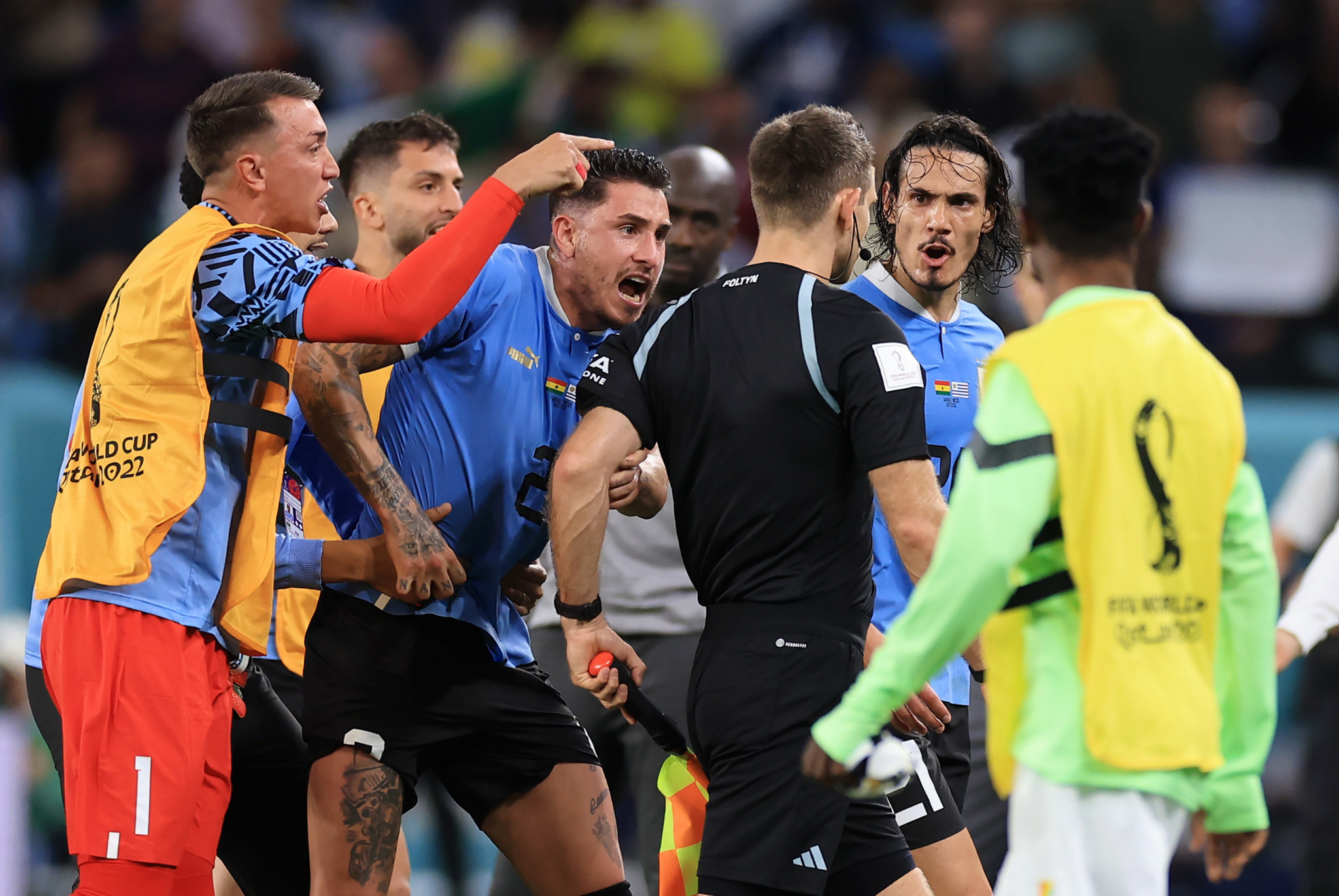 Uruguayan players surround the referee post-match for not awarding their side a penalty ©Getty Images