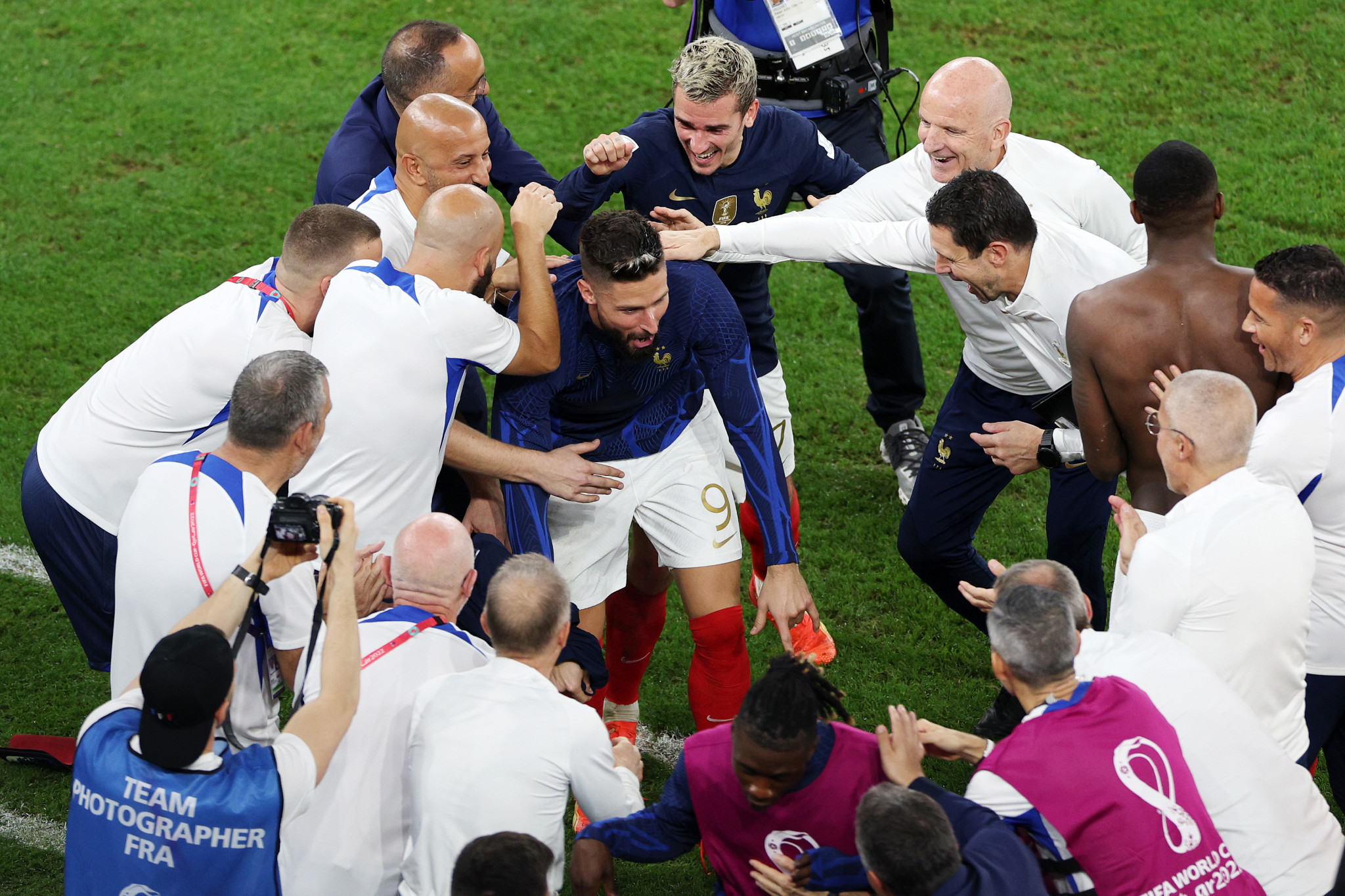 Players and staff congratulate Olivier Giroud, centre, after he became France's record goalscorer with 52 goals ©Getty Images