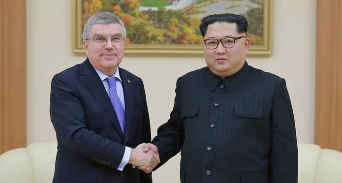 Thomas Bach, left, claimed North Korea, under Supreme Leader Kim Jong-un, right, had failed to fulfil its obligations by missing Tokyo 2020 ©IOC
