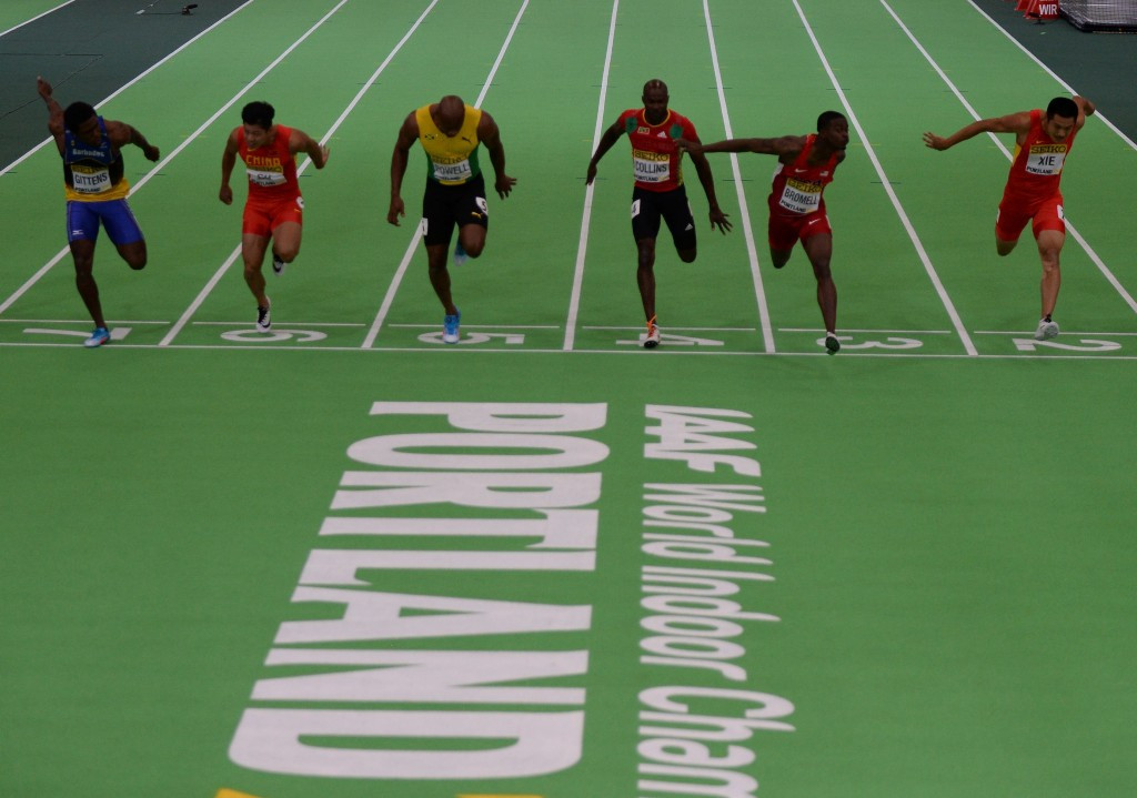 Trayvon Bromell (second right) crosses the line to win gold ahead of Asafa Powell to win 60m gold ©Getty Images