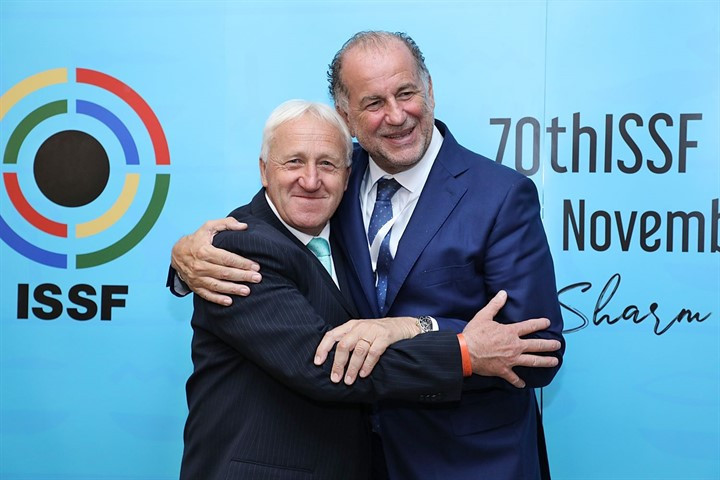 Luciano Rossi, right, celebrates with Willi Grill, left, after being elected the new President of the ISSF ©ISSF
