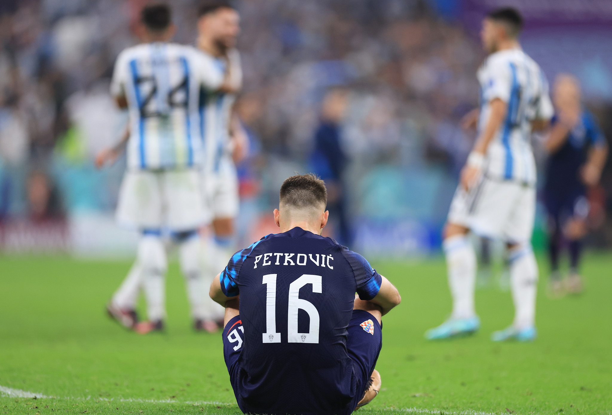 Croatia's Bruno Petkovic sits on the pitch following his side's loss to Argentina ©Getty Images