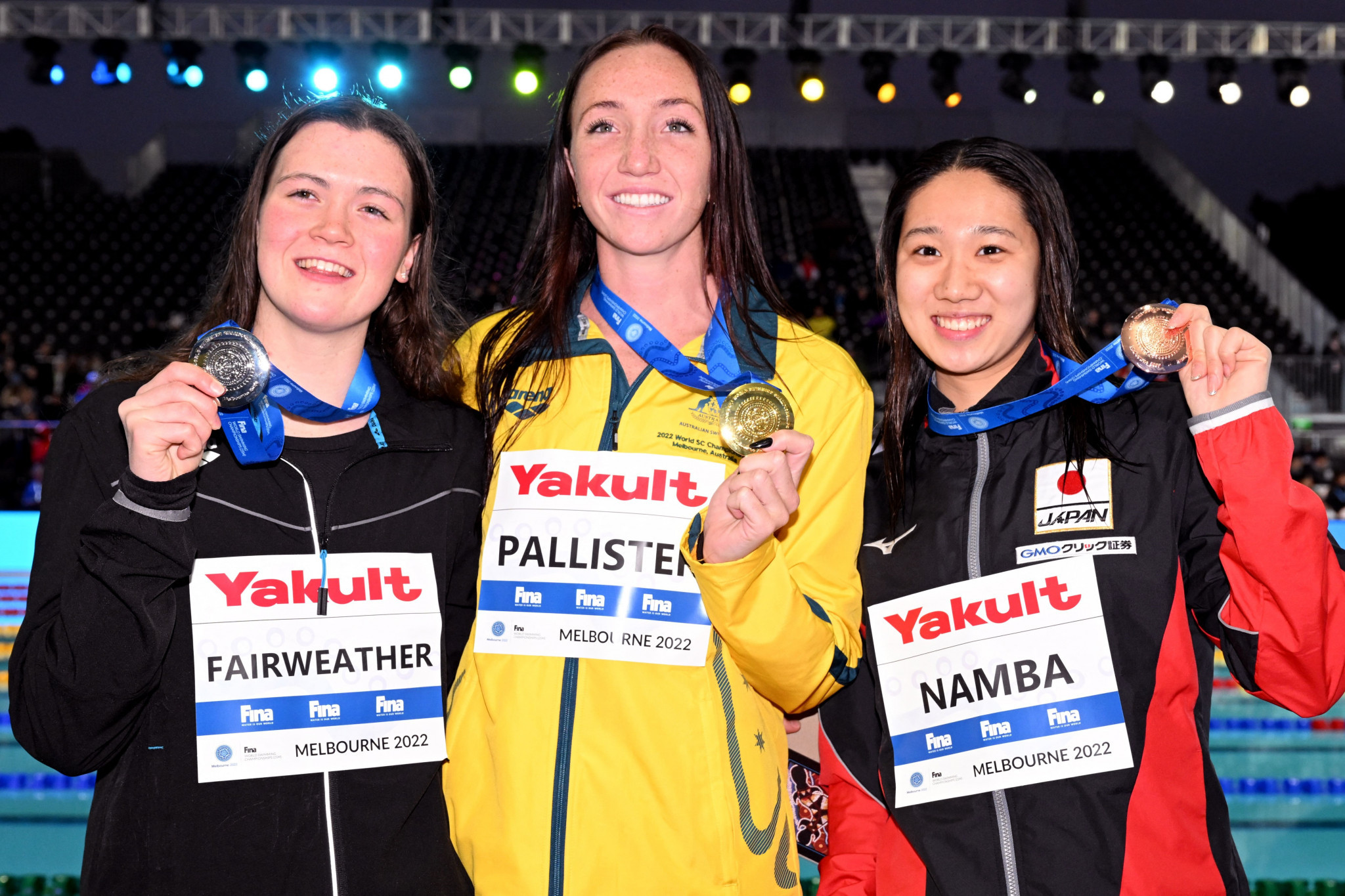 Lani Pallister, middle, shows off her gold medal after winning the women's 800m freestyle title ©Getty Images