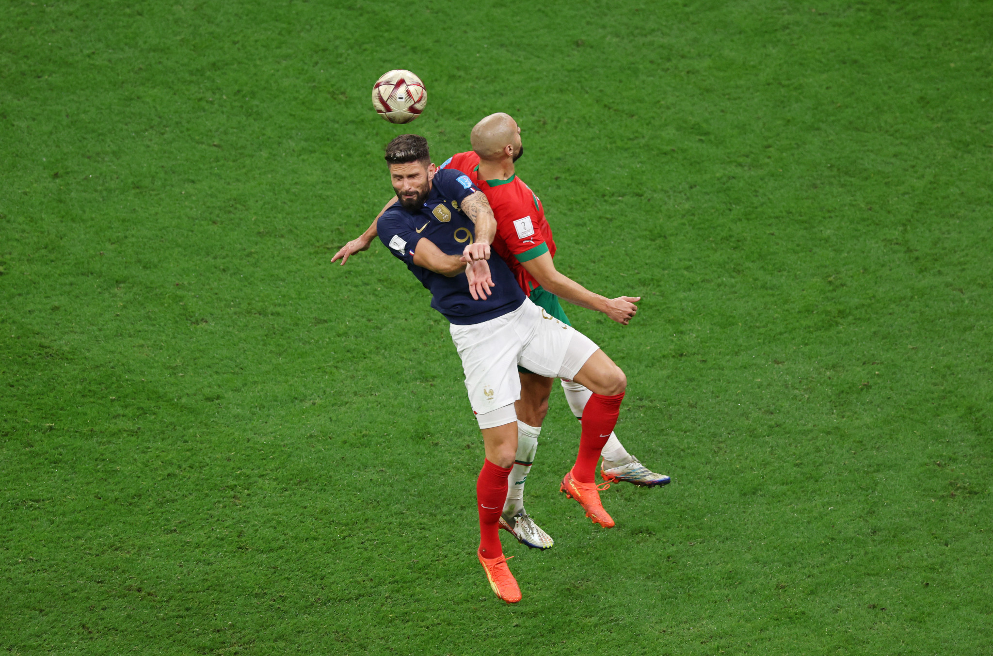 Olivier Giroud and Sofyan Amrabat challenge for the ball during France's match with Morocco ©Getty Images