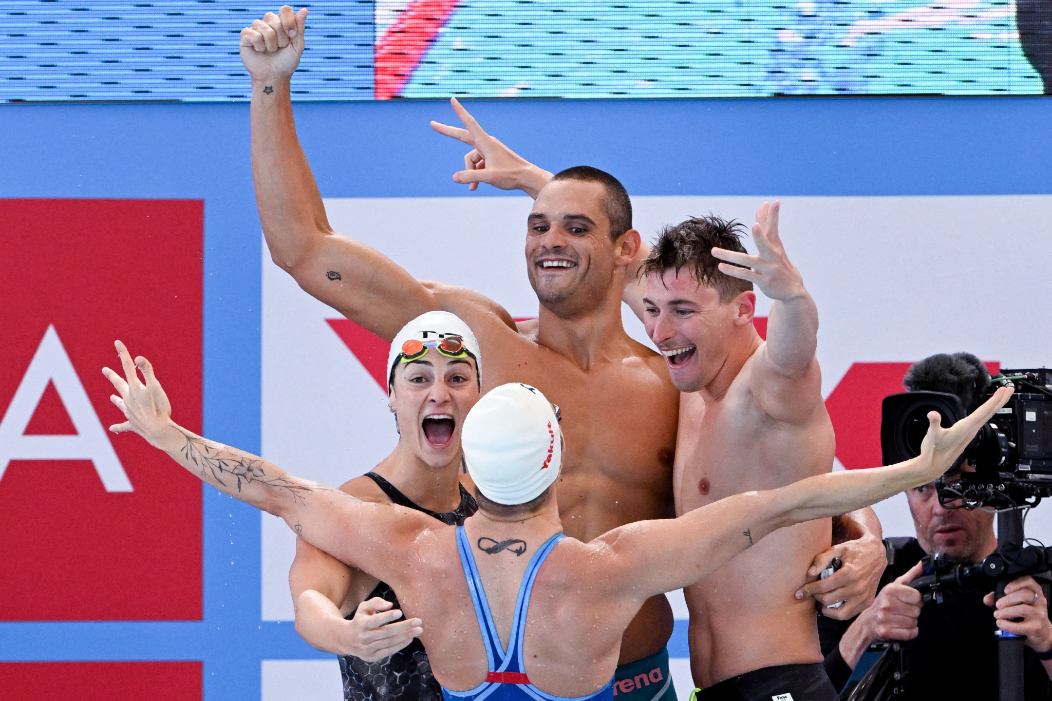 The French team are overjoyed after winning the mixed 4x50m freestyle relay crown ©Getty Images