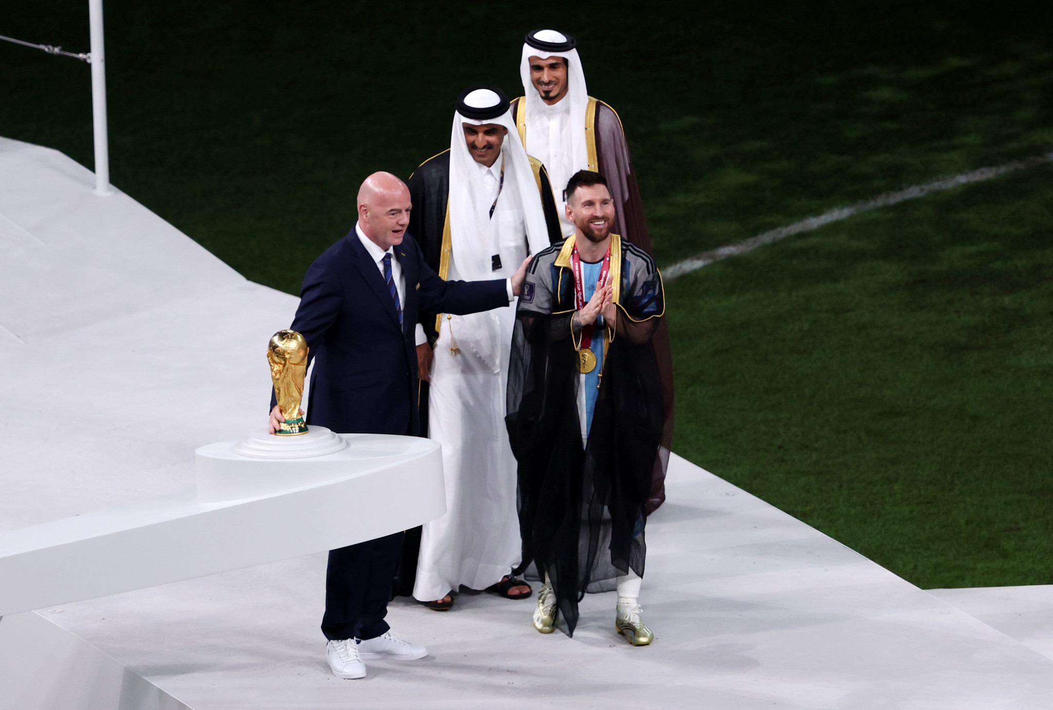 FIFA President Gianni Infantino giving Lionel Messi the World Cup trophy ©Getty Images