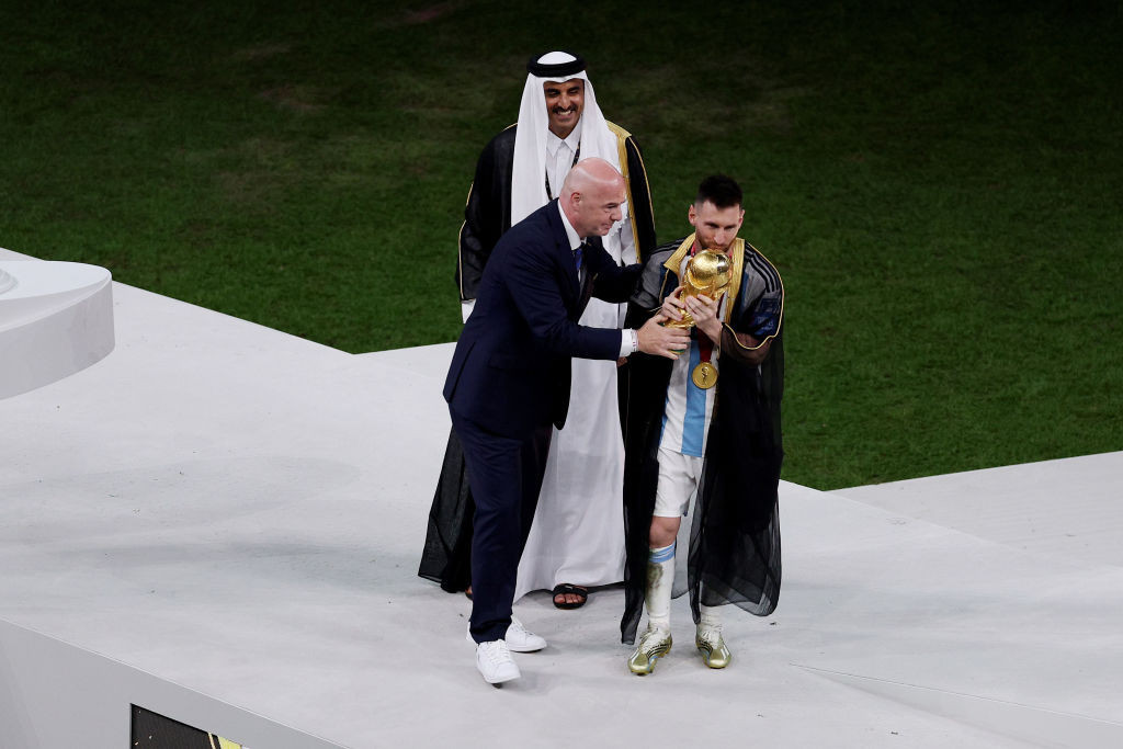 FIFA President Gianni Infantino takes centre stage alongside victorious Argentina captain Lionel Messi after the Qatar 2022 World Cup final ©Getty Images