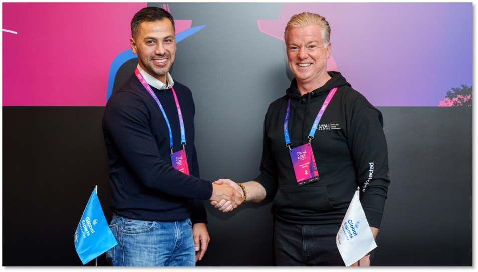 Jerry Gamez, VOV Gaming chief executive, left, and Paul Foster, GEF chief executive, right, agree on a deal that is hoped will help esports develop at the grassroots ©GEF