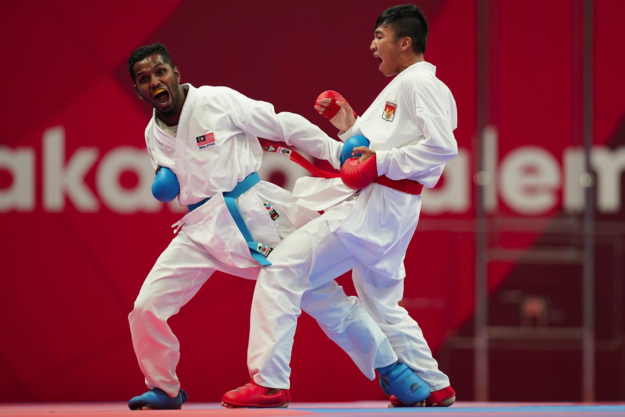 Malaysia's Prem Kumar Selvam, left, took bronze in the men's under-55kg at the Asian Karate Championships in Tashkent ©Getty Images