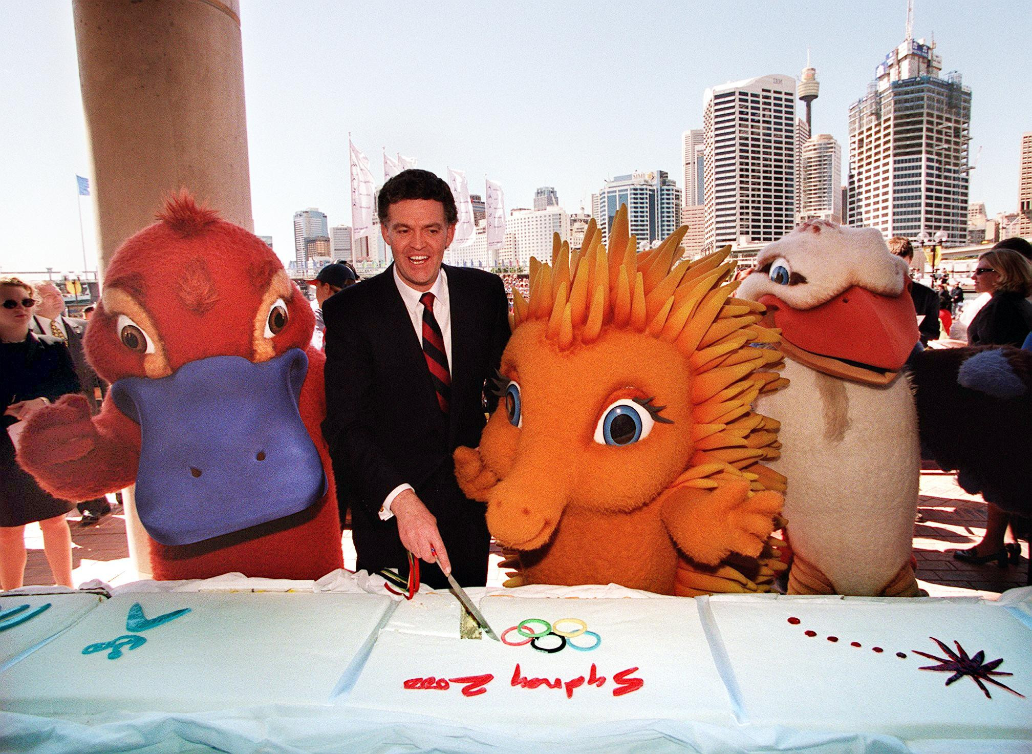The three mascots for Sydney 2000, seen with Organising Committee President Michael Knight, were ever-present in the build-up to the Games ©Getty Images