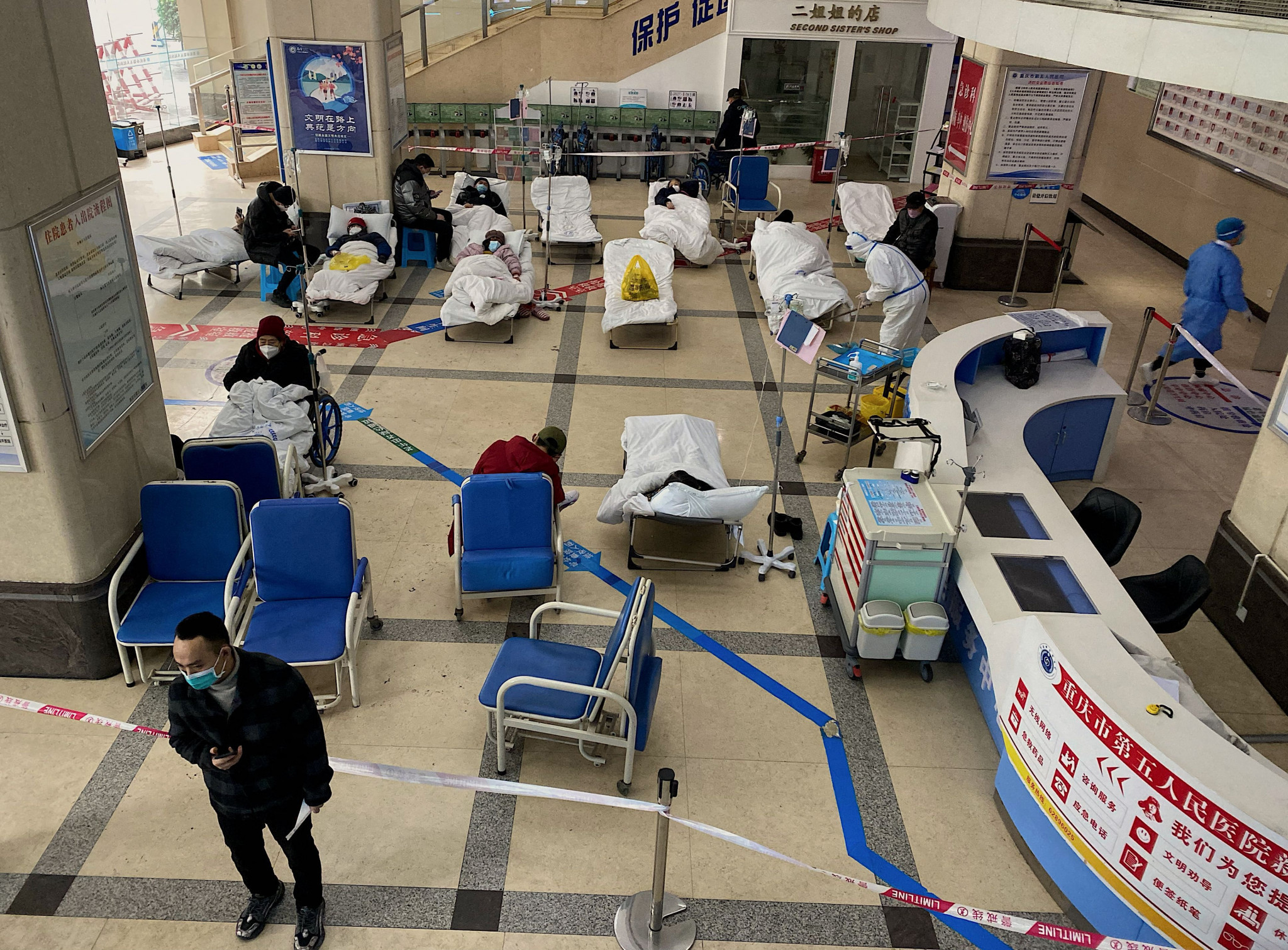COVID-19 patients in the lobby of Chongqing hospital number 5 in Southern China, where official casualty figures are being questioned ©Getty Images