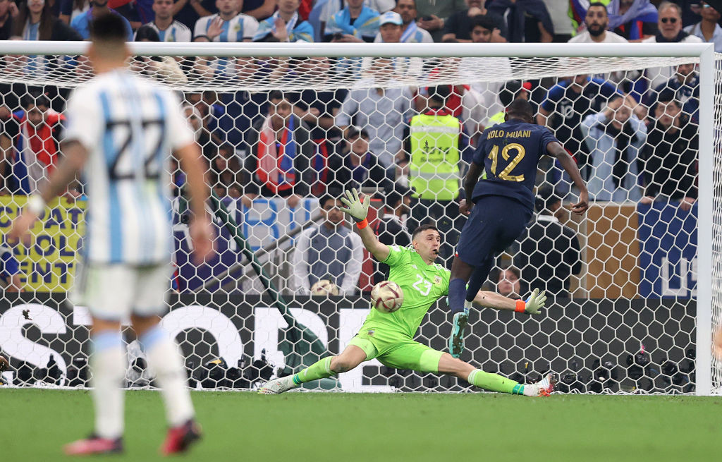 Argentina's Emiliano Martinez saves from France's Randal Kolo Muani in the last seconds of extra time in the 2022 World Cup final ©Getty Images