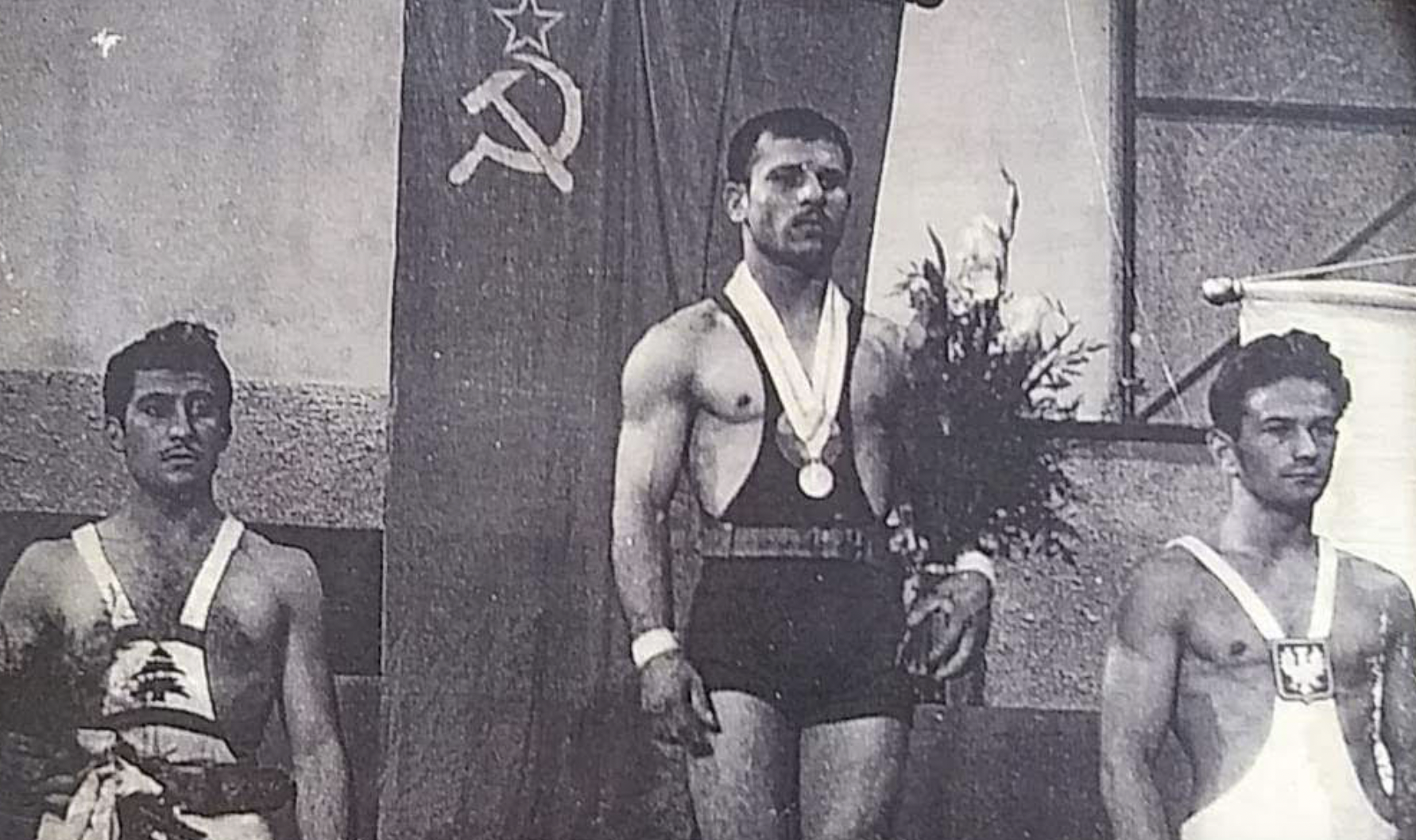 Tchobanian, left, on the podium alongside athletes from the Soviet Union and Poland following a competition in Budapest, Hungary ©ITG