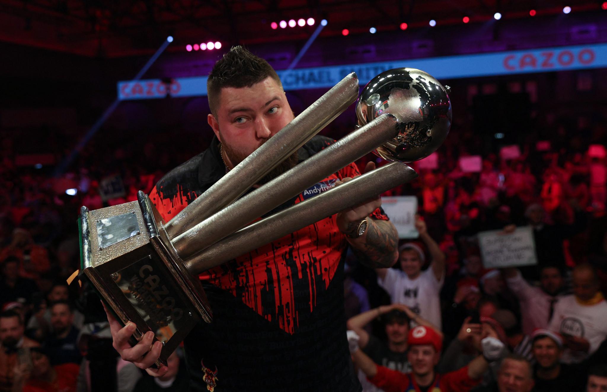 Smith hits nine-darter on way to claiming first PDC World Darts Championship crown