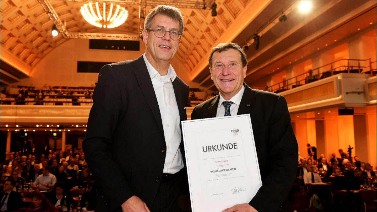 WKF vice-president Wolfgang Weigert, right, with DOSB President Thomas Weikert after receiving his top award ©WKF