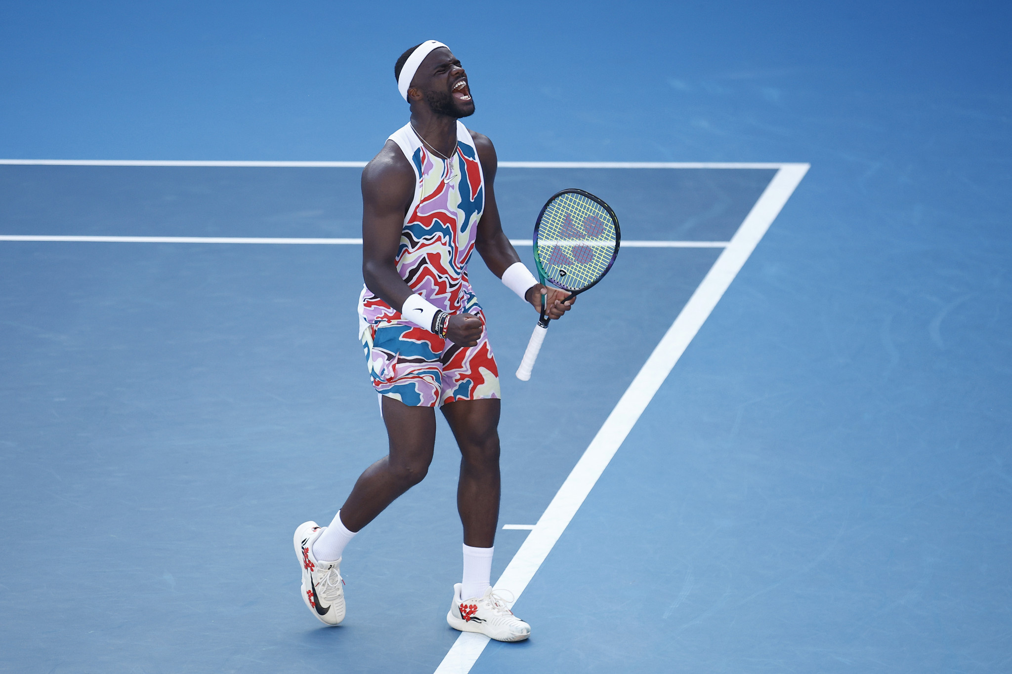 Frances Tiafoe of the United States kitted out in vibrant colours on his way to a first-round victory ©Getty Images