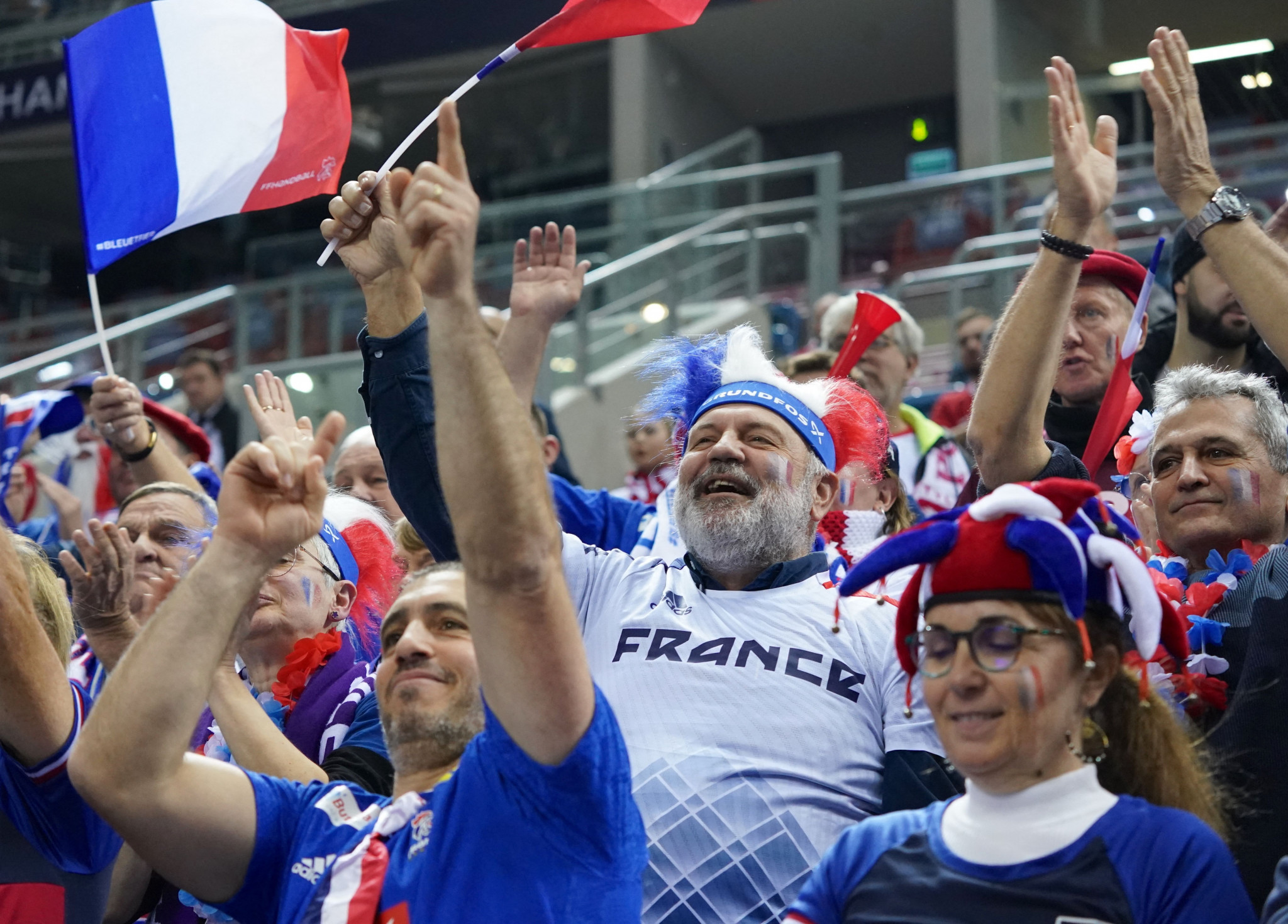 France fans celebrate after their team took a big step in their campaign to win the IHF Men's World Championship for the first time since 2017 ©Getty Images
