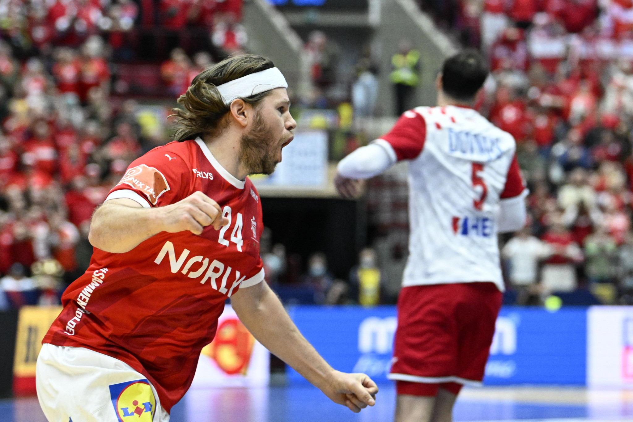 Mikkel Hansen celebrates scoring for Denmark in their tied contest with Croatia ©Getty Images 