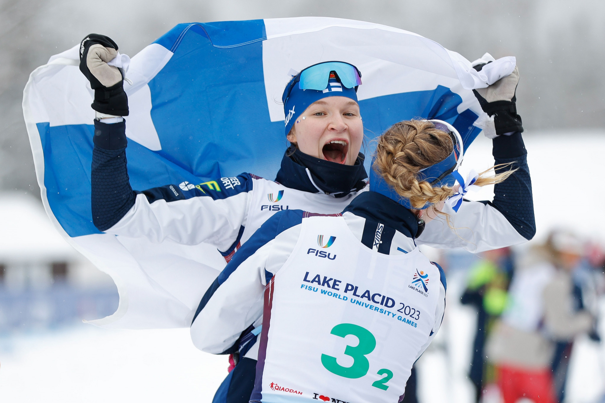 Finland celebrate after winning the women's 3x5km cross-country skiing relay after benefiting from a mistake from Japan ©FISU