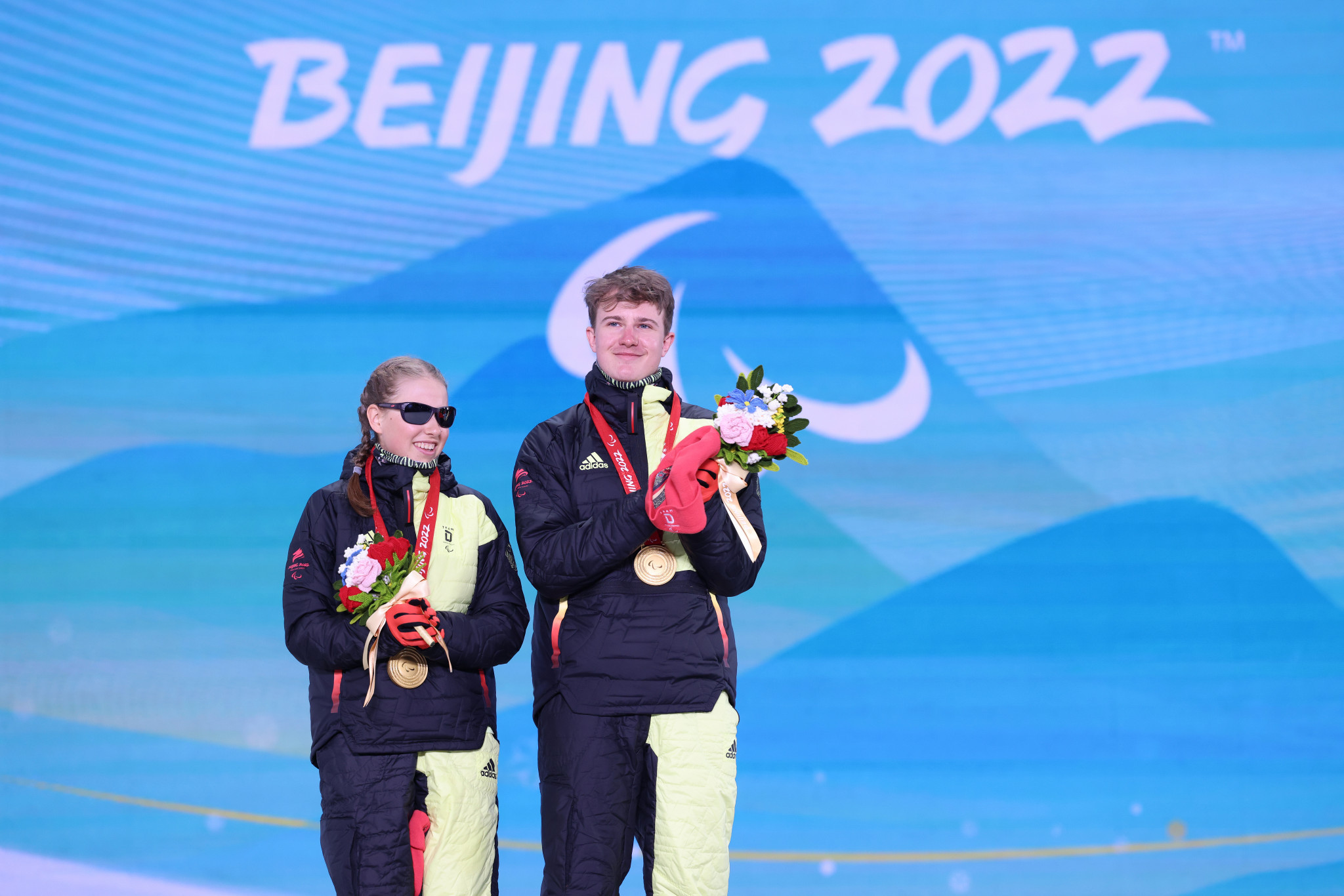 Linn Kazmaier, pictured alongside her guide Florian Baumann, won five medals at the Beijing 2022 Winter Paralympics ©Getty Images