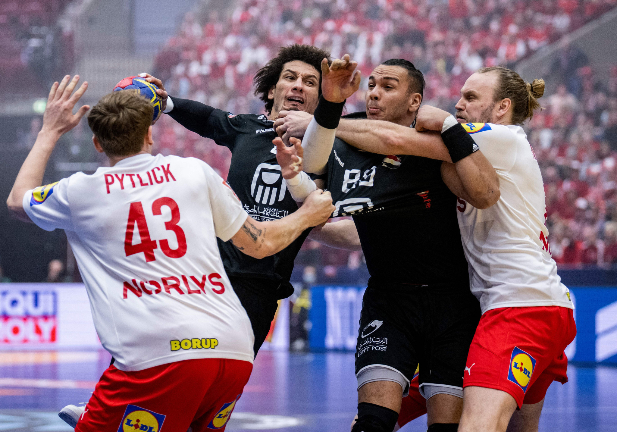 Denmark, playing in white, secured the final quarter-final place at the World Men's Handball Championship ©Getty Images