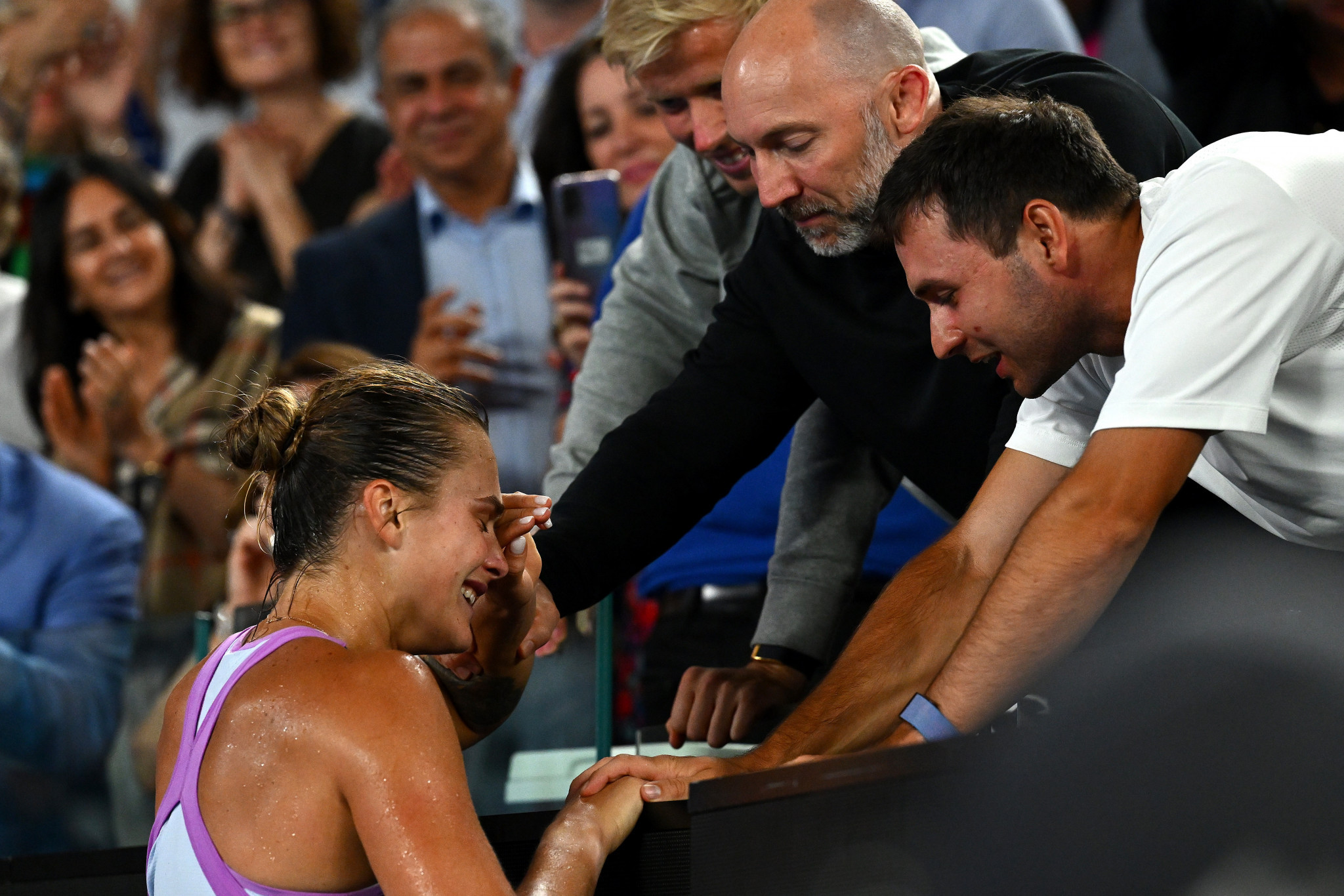 Sabalenka struggled to keep a lid on her emotions as she greets her coaching team ©Getty Images